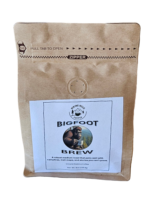 Kraft paper package with Bigfoot Brew label on a wooden surface