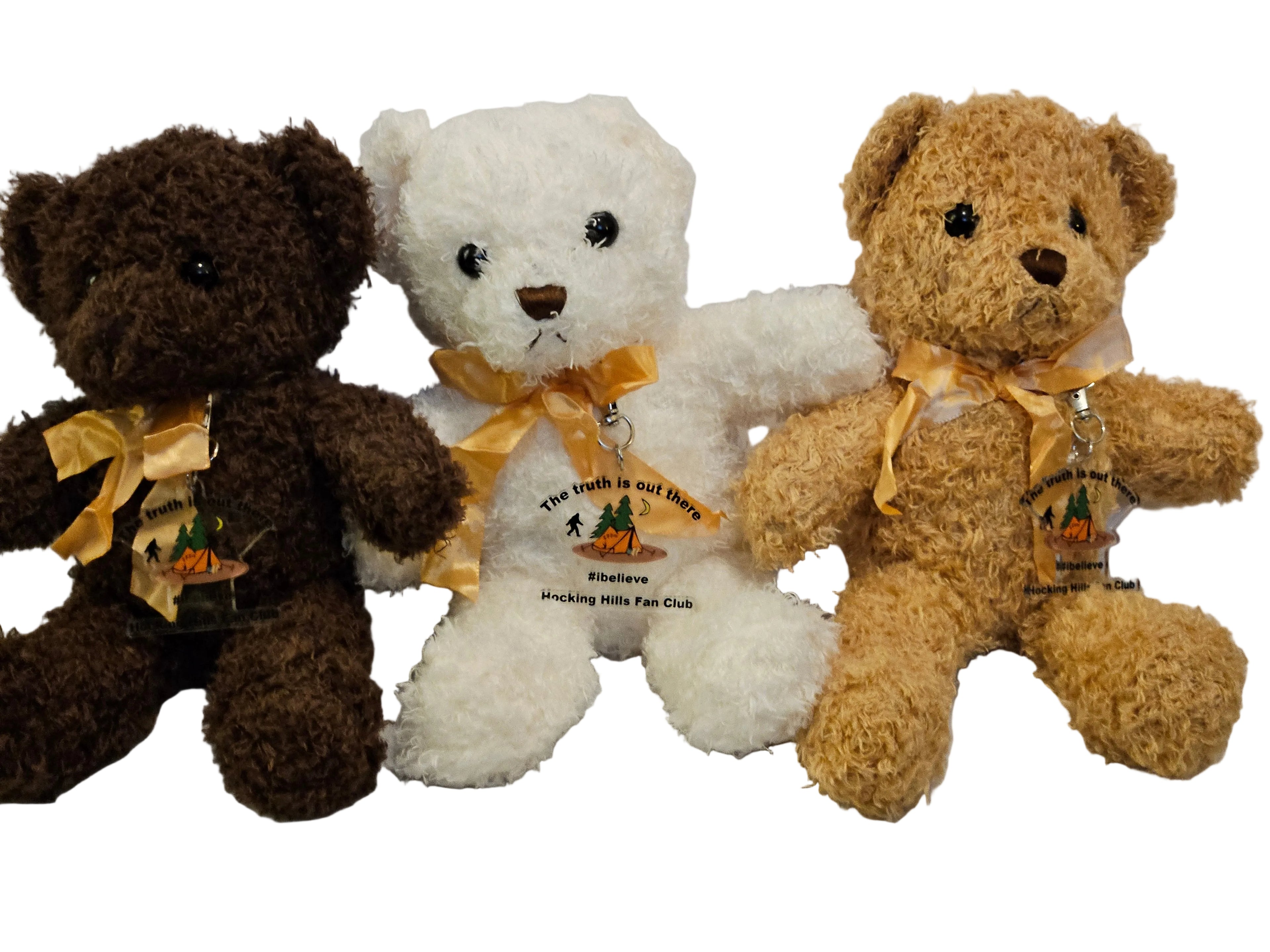 Three teddy bears in brown, white, and beige with decorative ribbons on a light gray background.