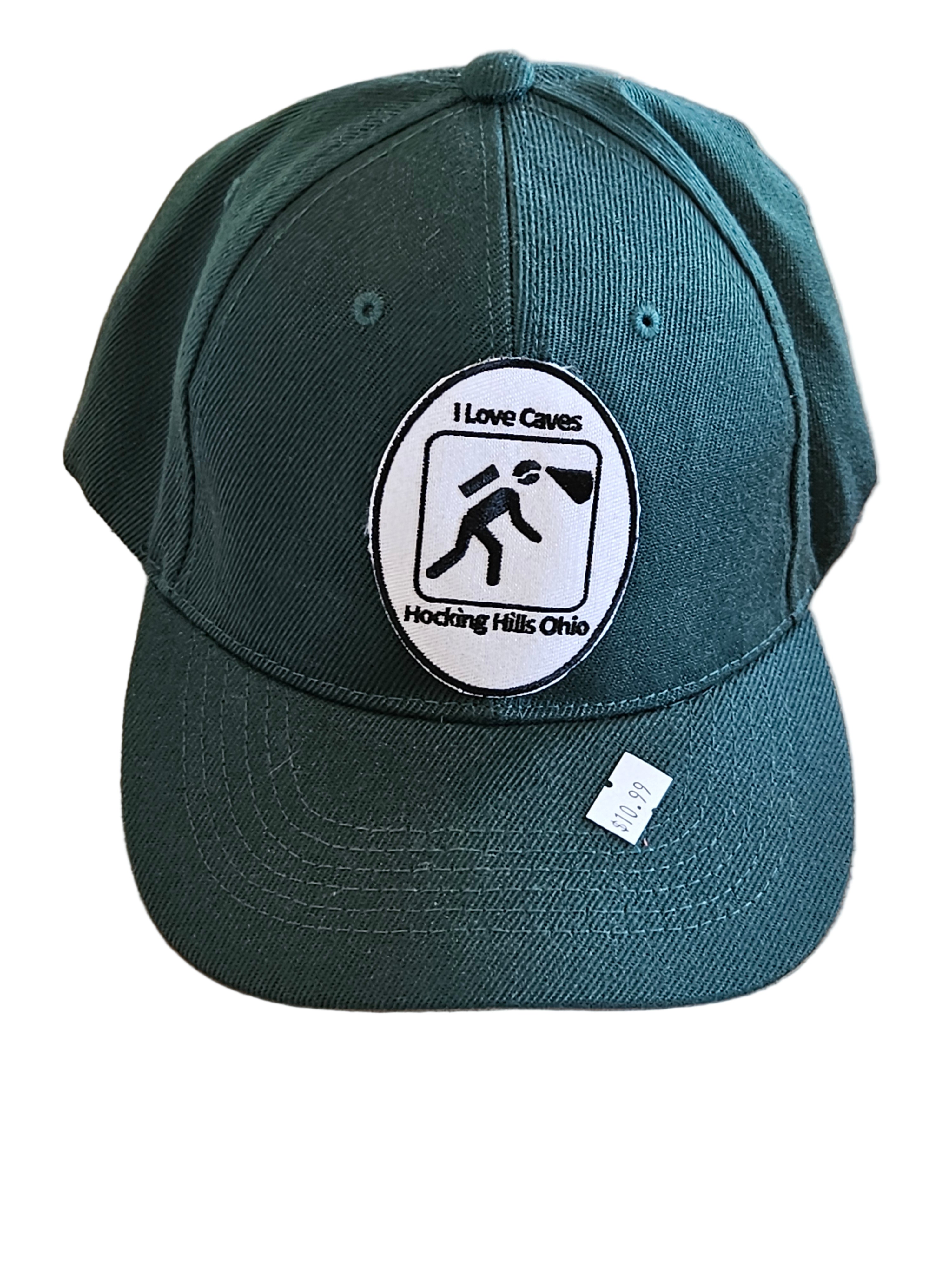 Green cap with a logo on a wooden surface