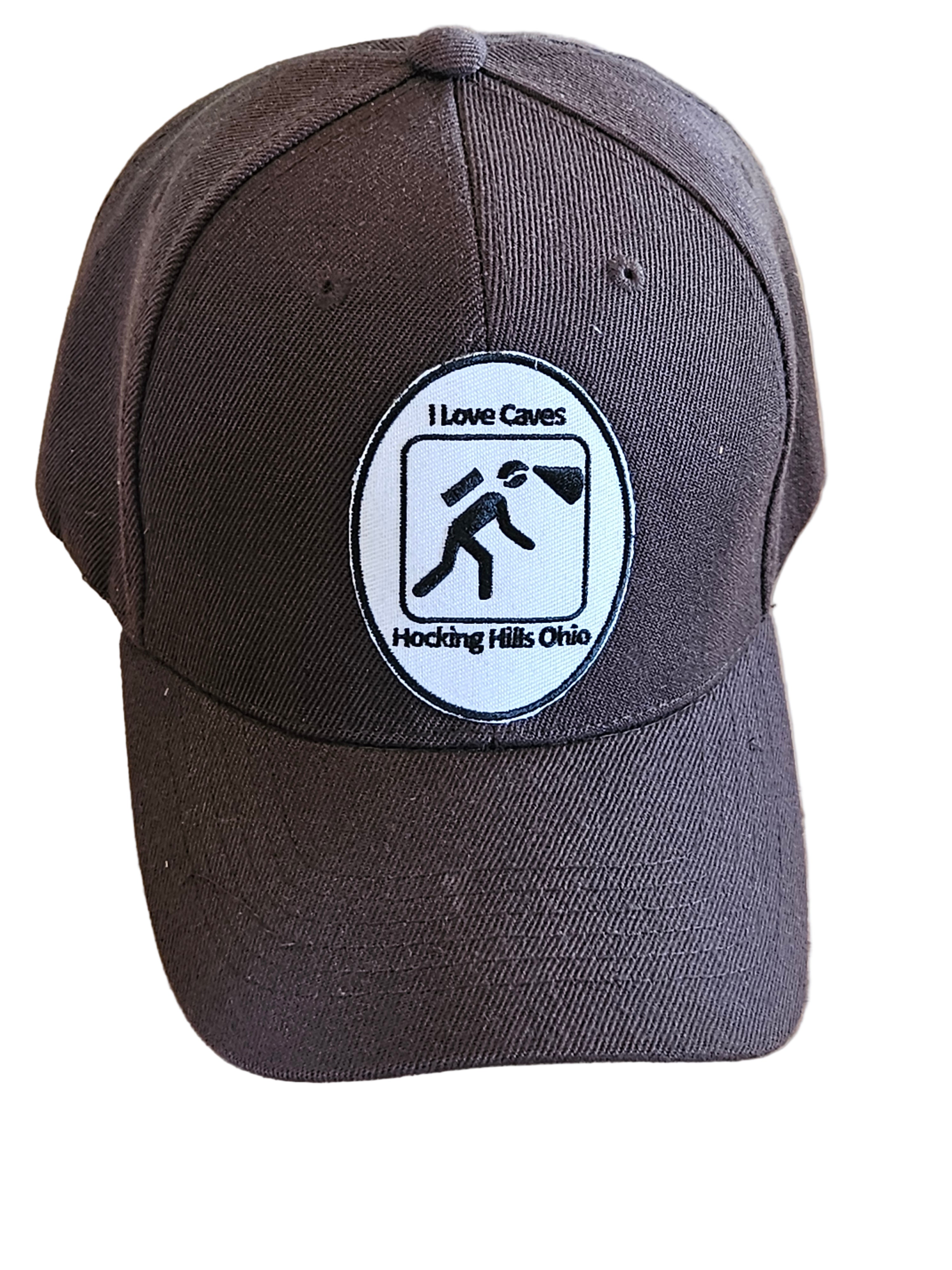 Black cap with a logo on a wooden surface