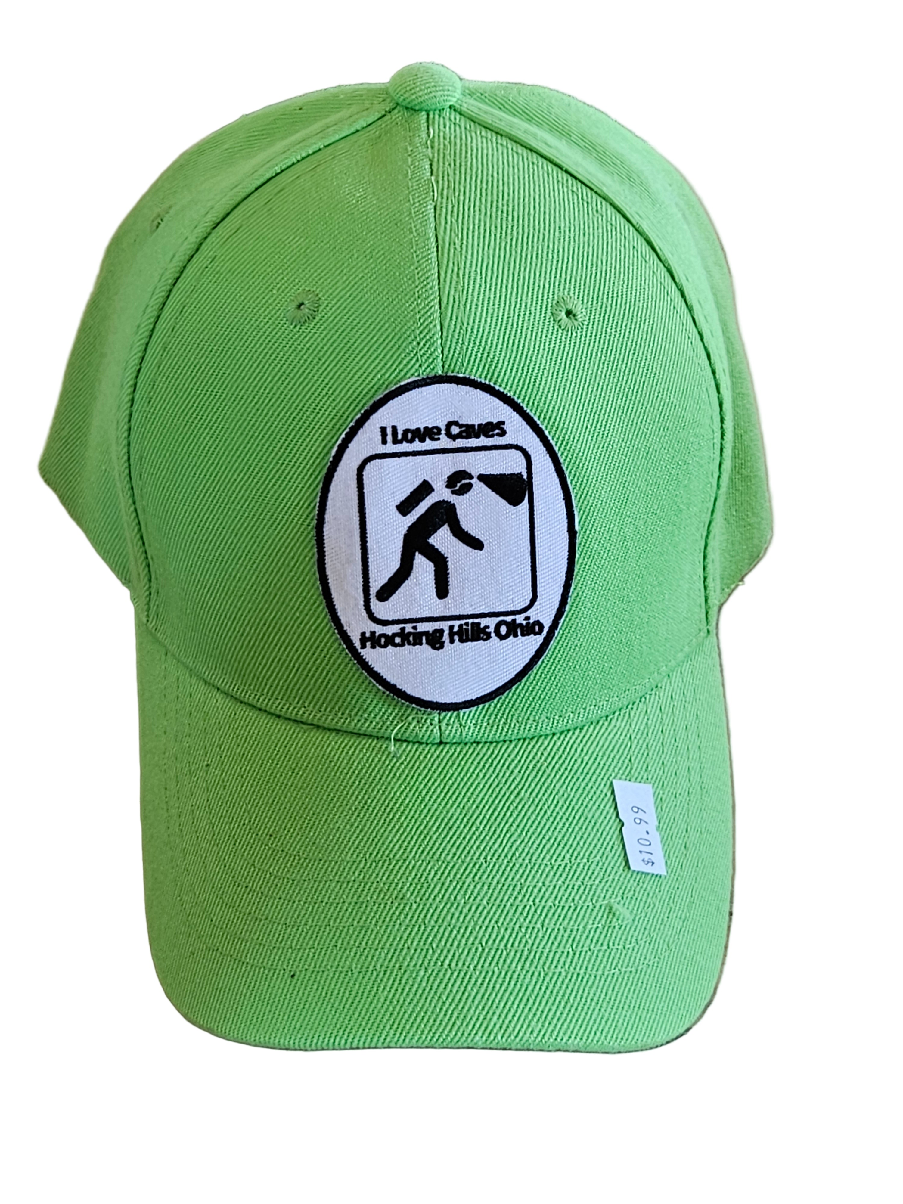 Green cap with a logo on a wooden surface