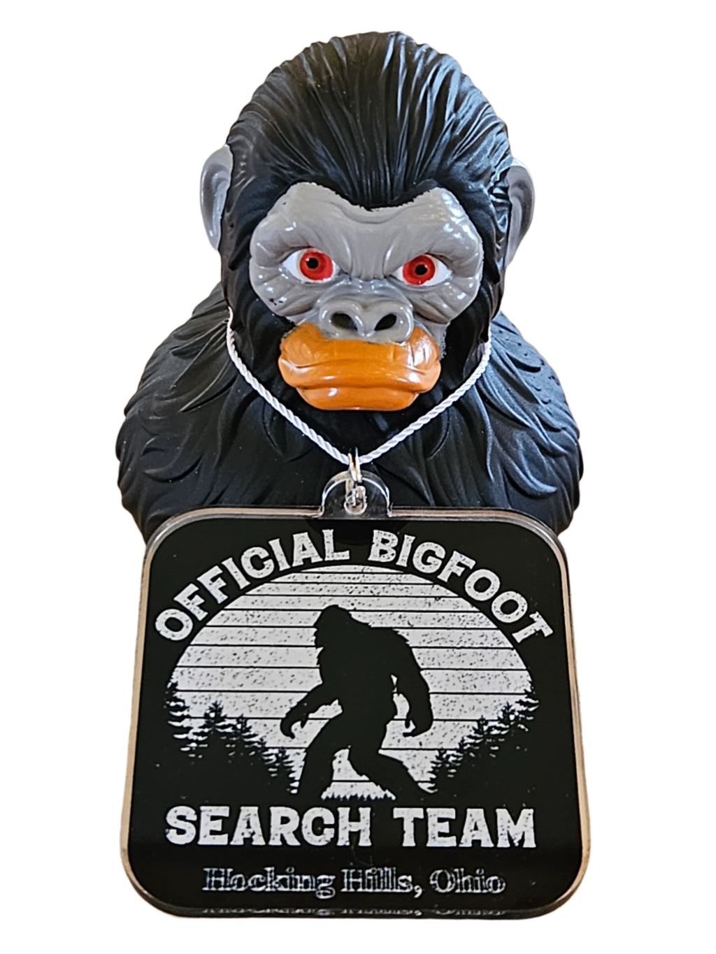 Bigfoot figurine with an 'Official Bigfoot Search Team' sign for a Jeep