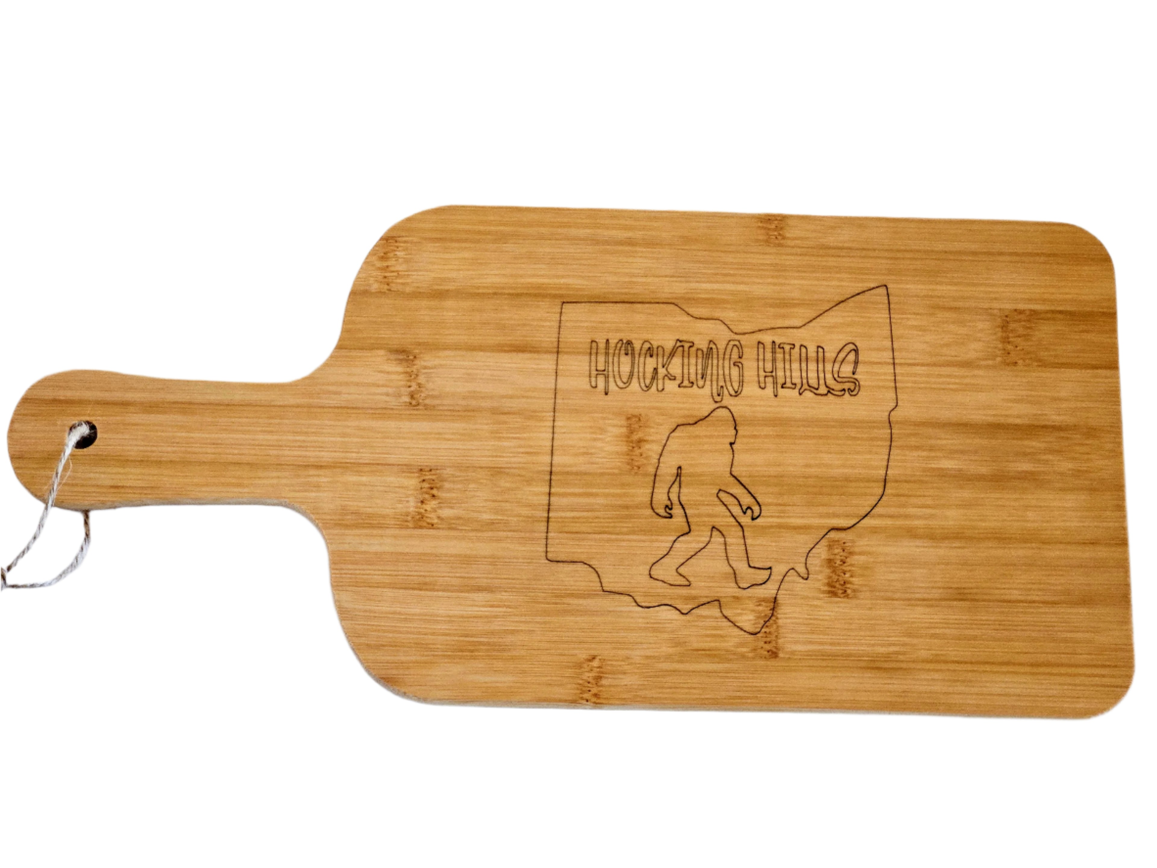 Wooden cutting board with engraved design of Ohio and Bigfoot silhouette on a white background