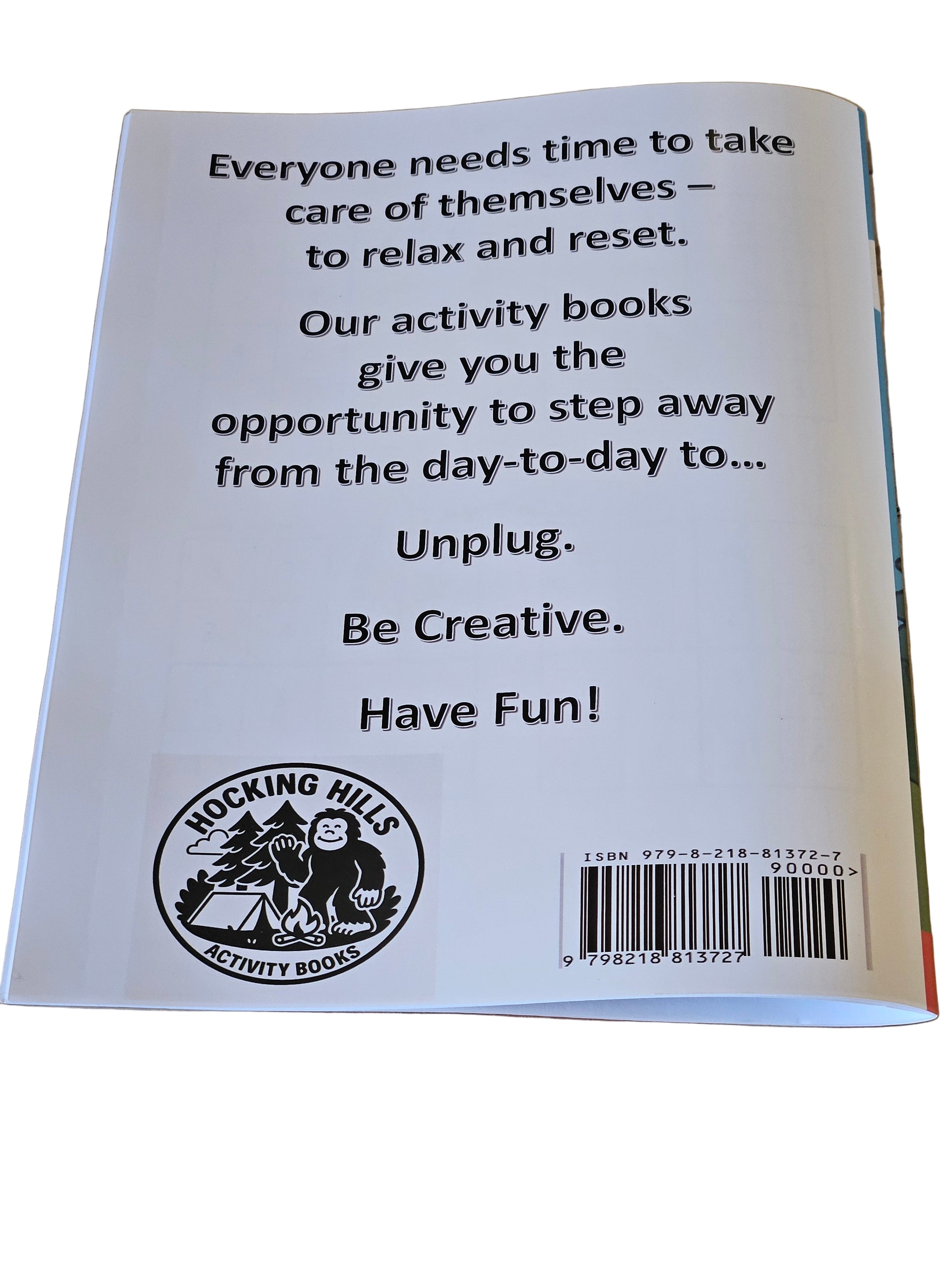 Back cover of a book with text and a logo on a wooden surface