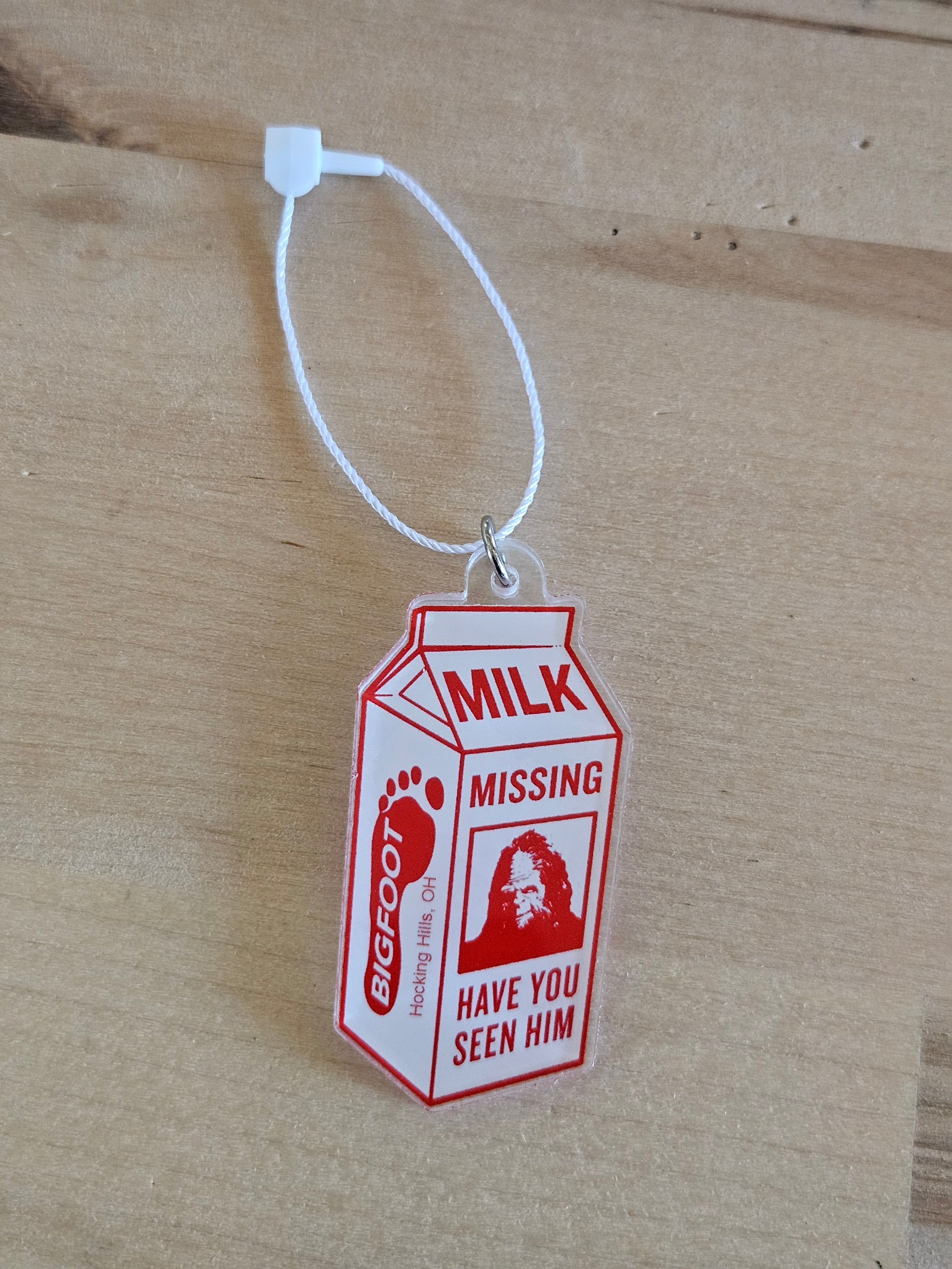 Milk missing sign with a tag on a cardboard background