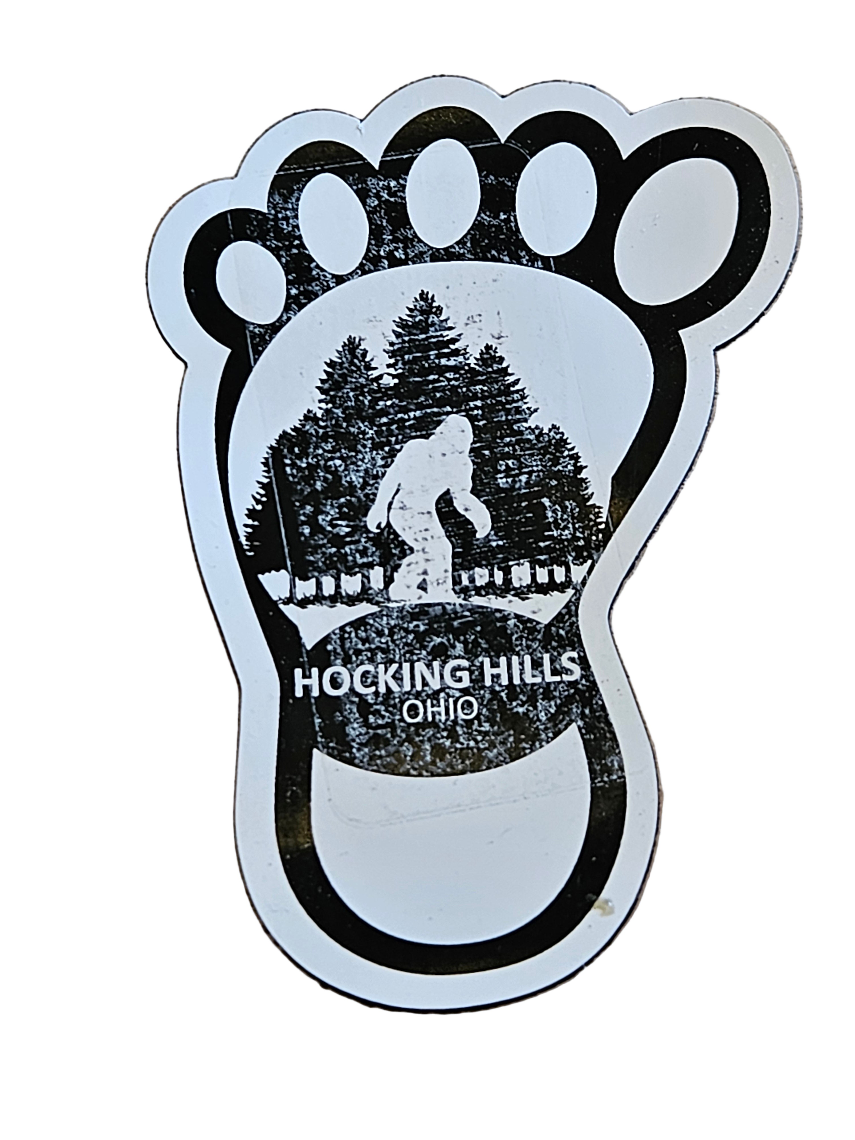 Sticker of a foot with a map of Hocking Hills, Ohio, on a white surface