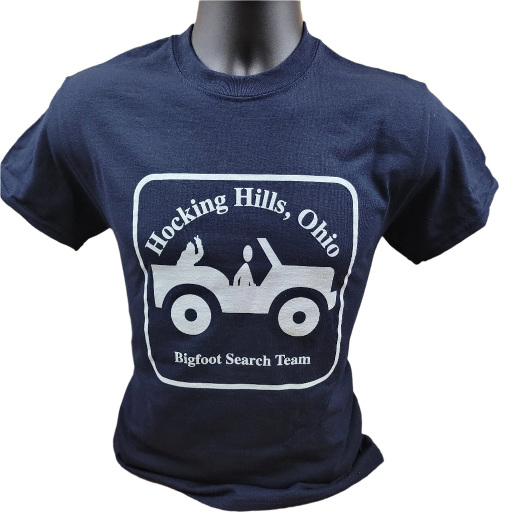 A navy blue t-shirt with a graphic print of a Jeep and the text 'Hocking Hills, Ohio Bigfoot Search Team'.