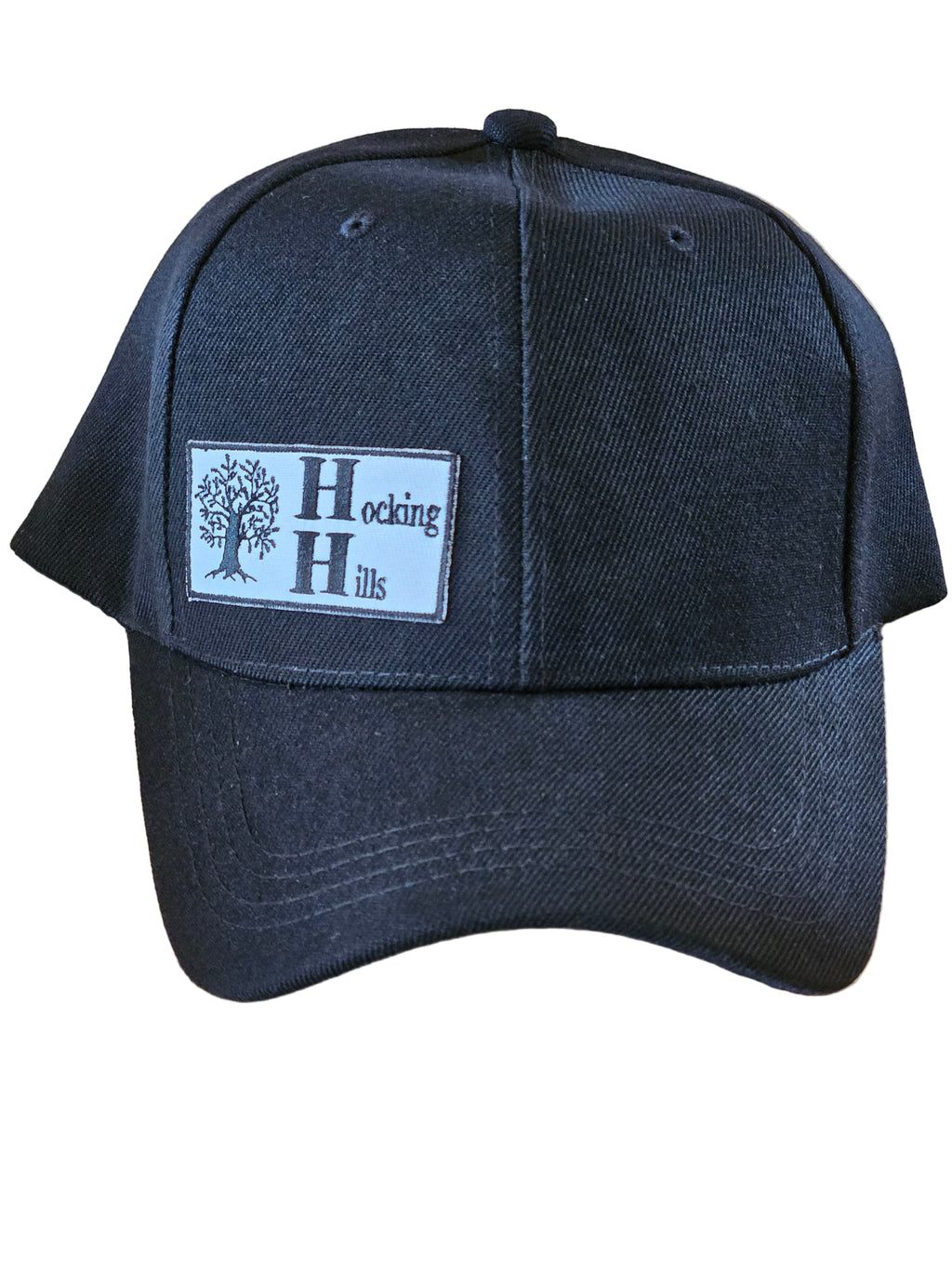 Black cap with a logo on a wooden surface