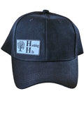 Black cap with a logo on a wooden surface
