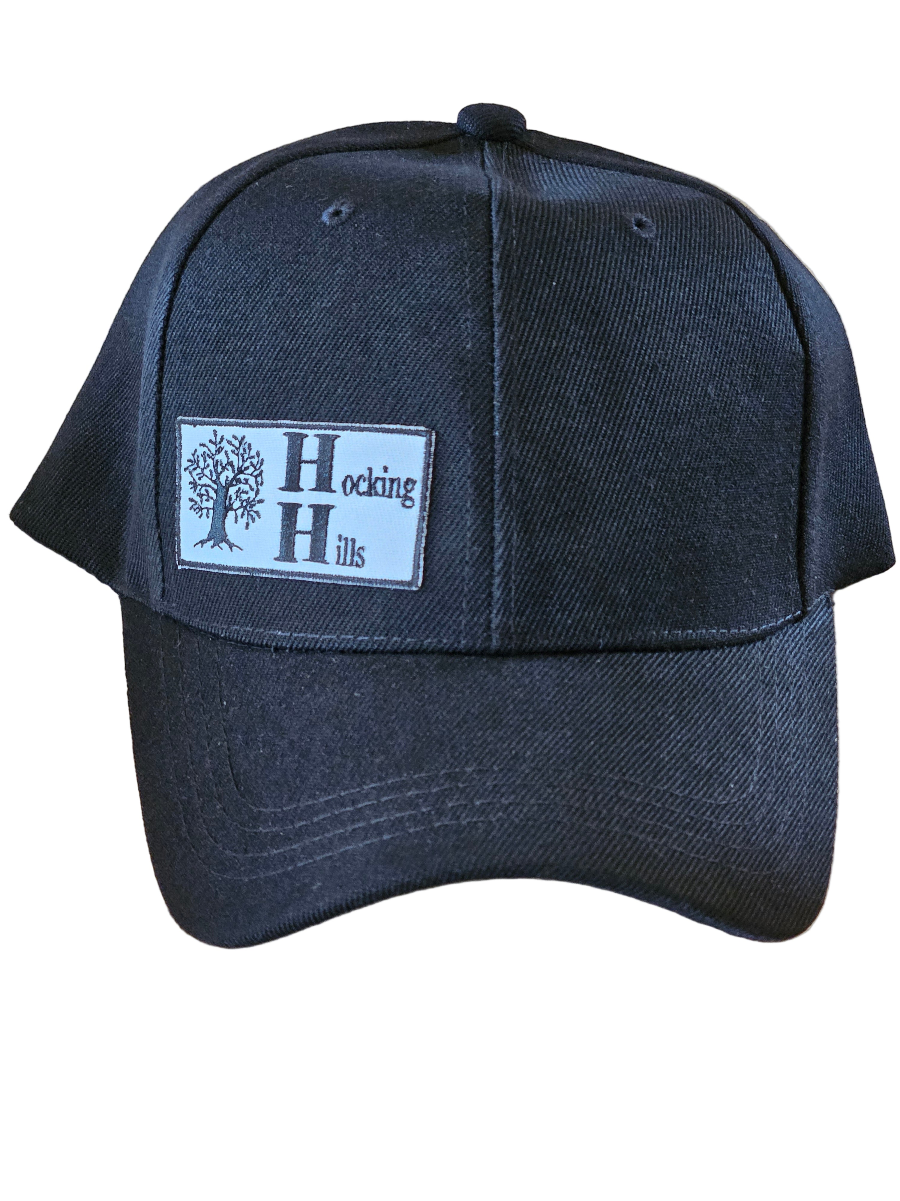 Black cap with a logo on a wooden surface