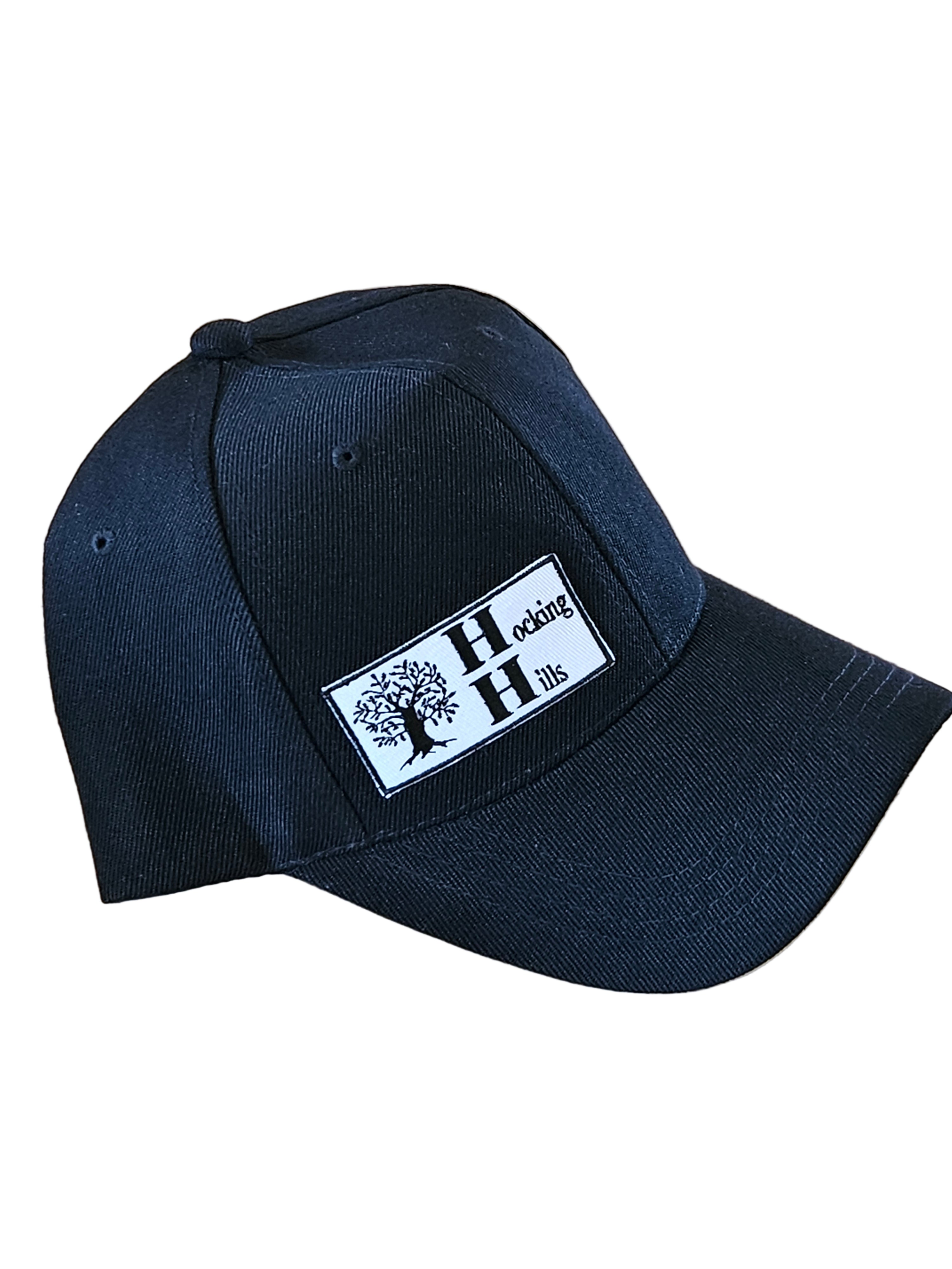 Navy blue cap with a white label on a wooden surface