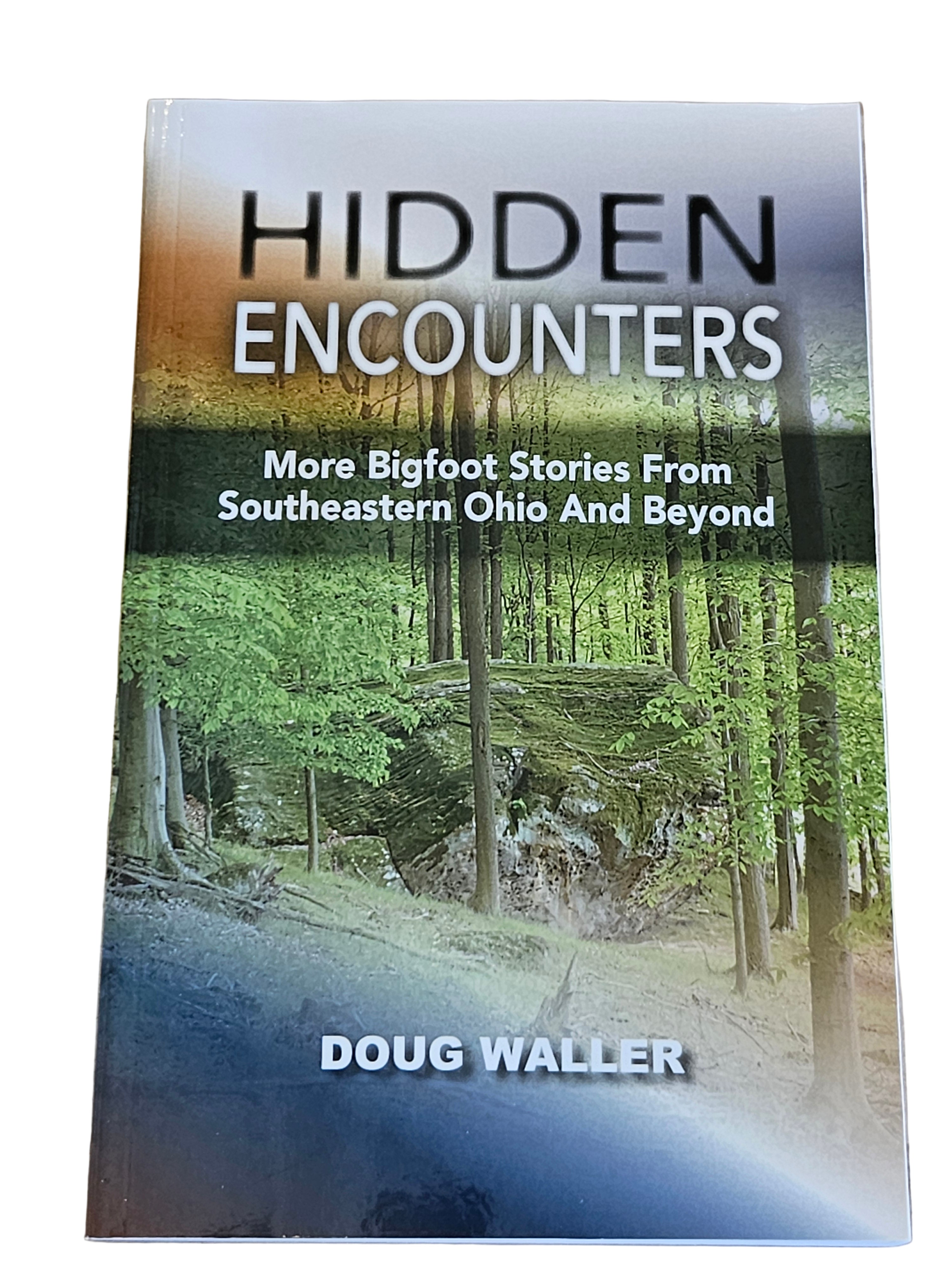 Book titled 'Hidden Encounters' by Doug Waller on a wooden surface