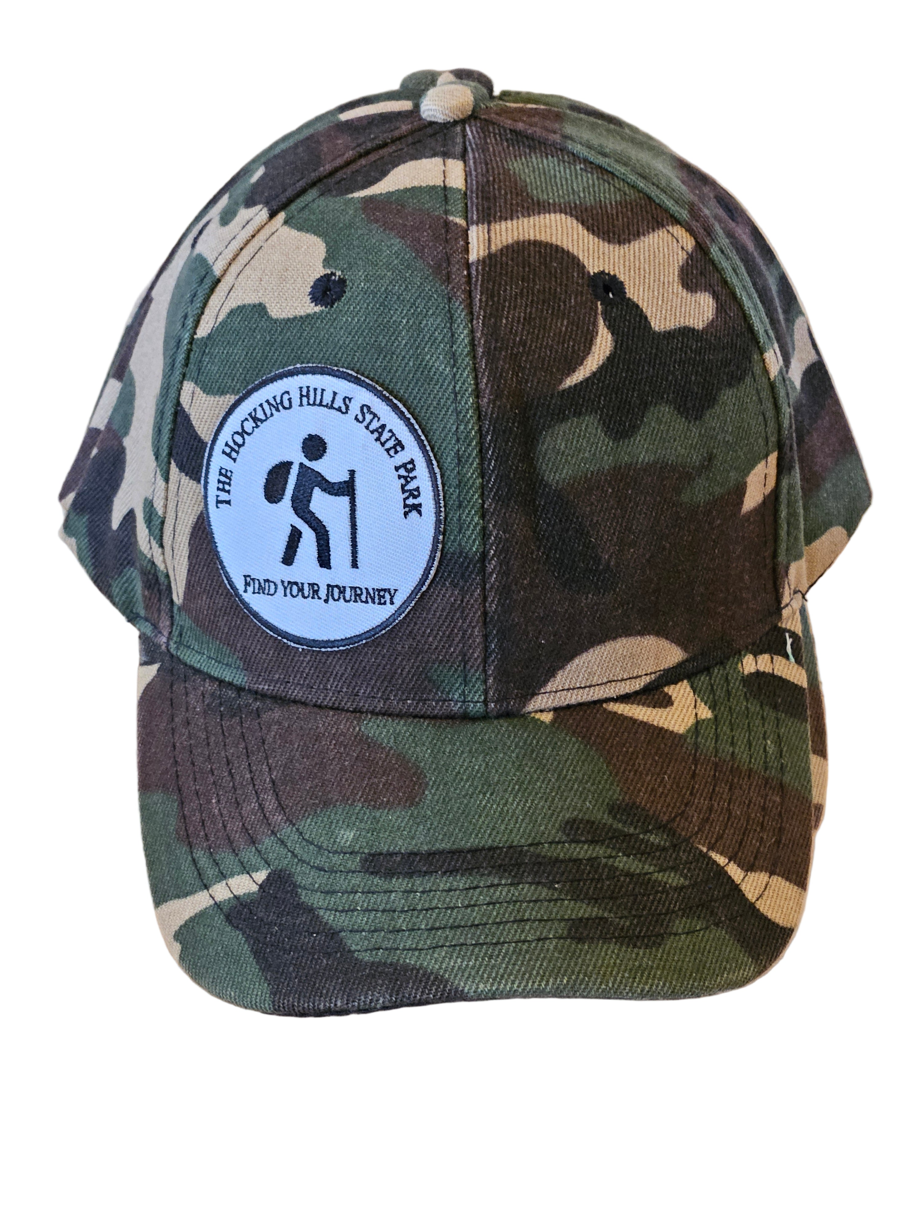 Camouflage cap with a logo on a wooden surface
