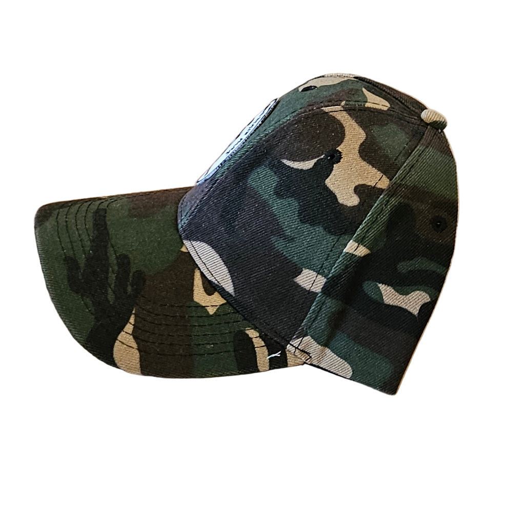 Camouflage-patterned cap on a white surface