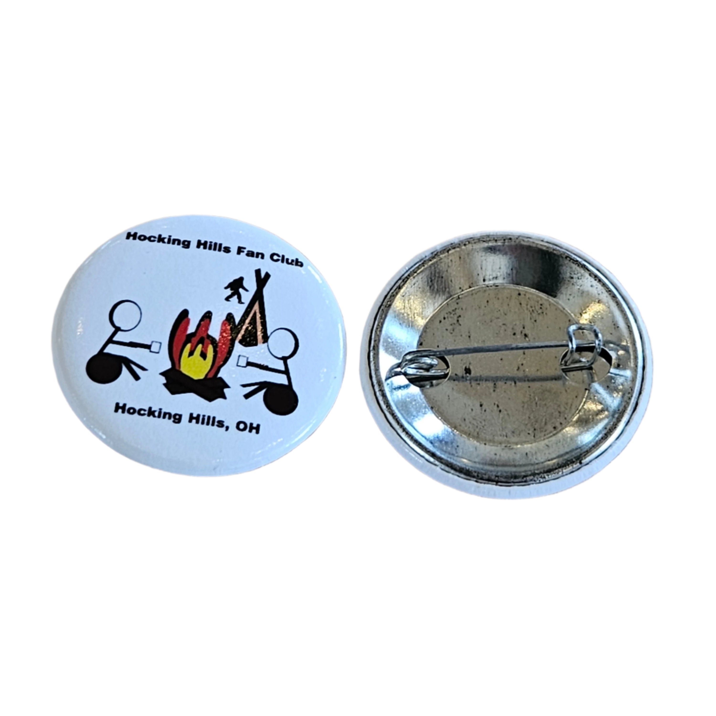 Button badge with a logo and text on a wooden surface