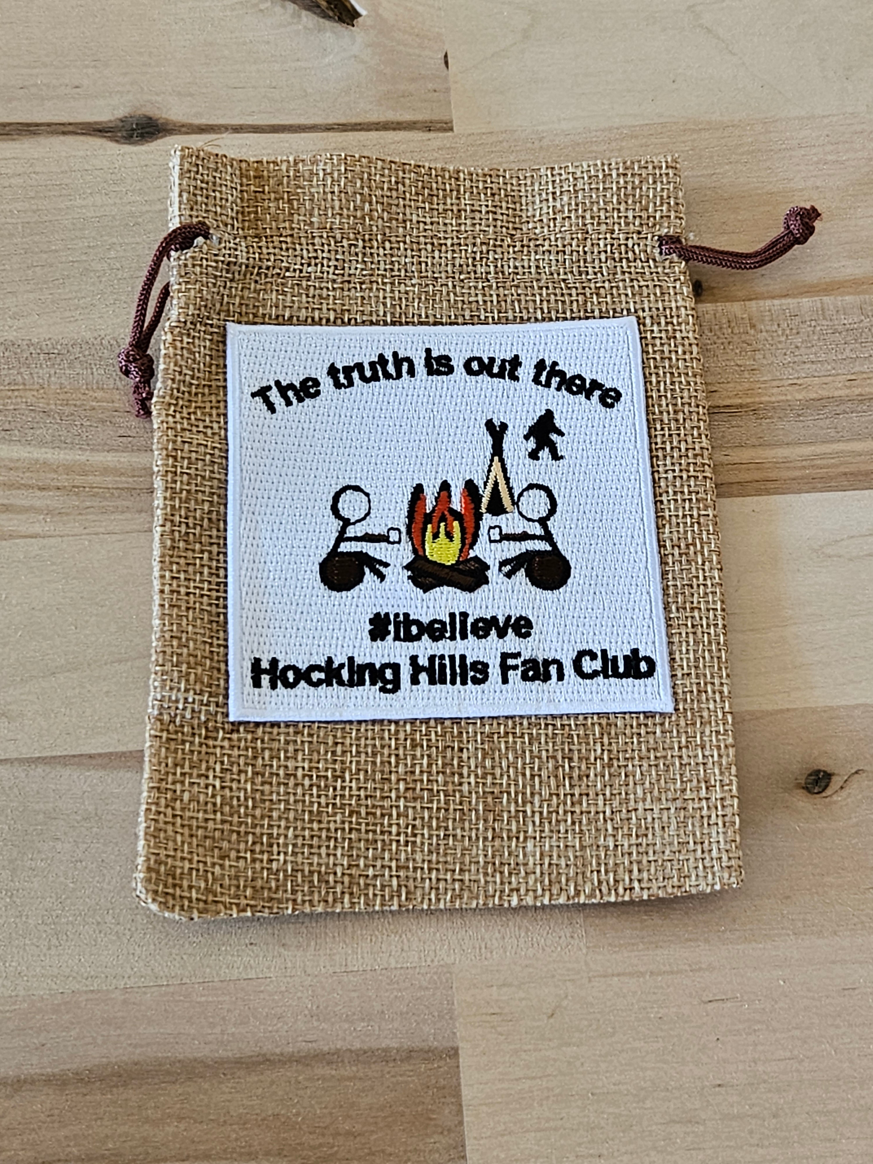  Burlap bag with a printed label featuring text and graphics on a white surface