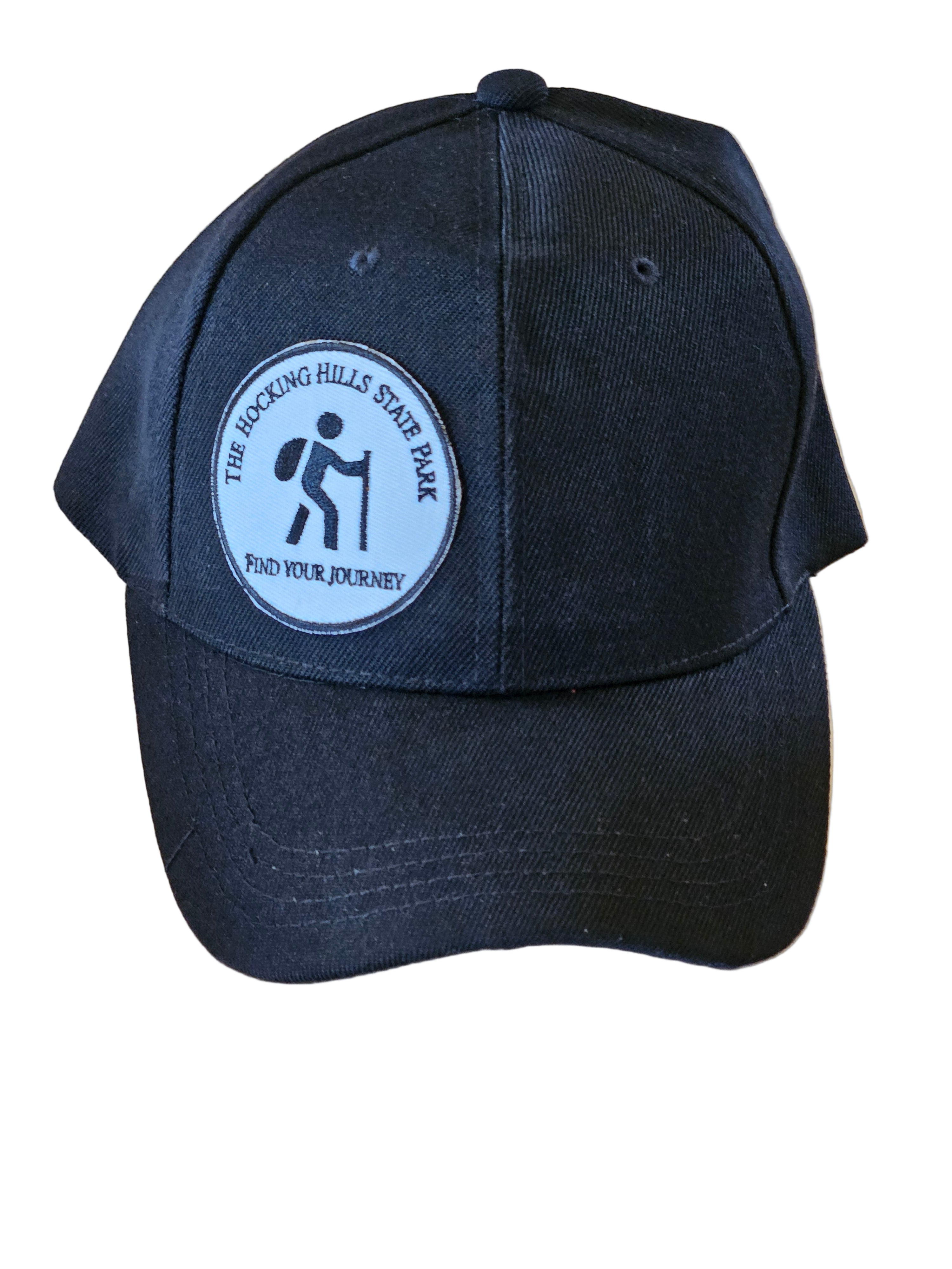 Black cap with a logo on a wooden surface