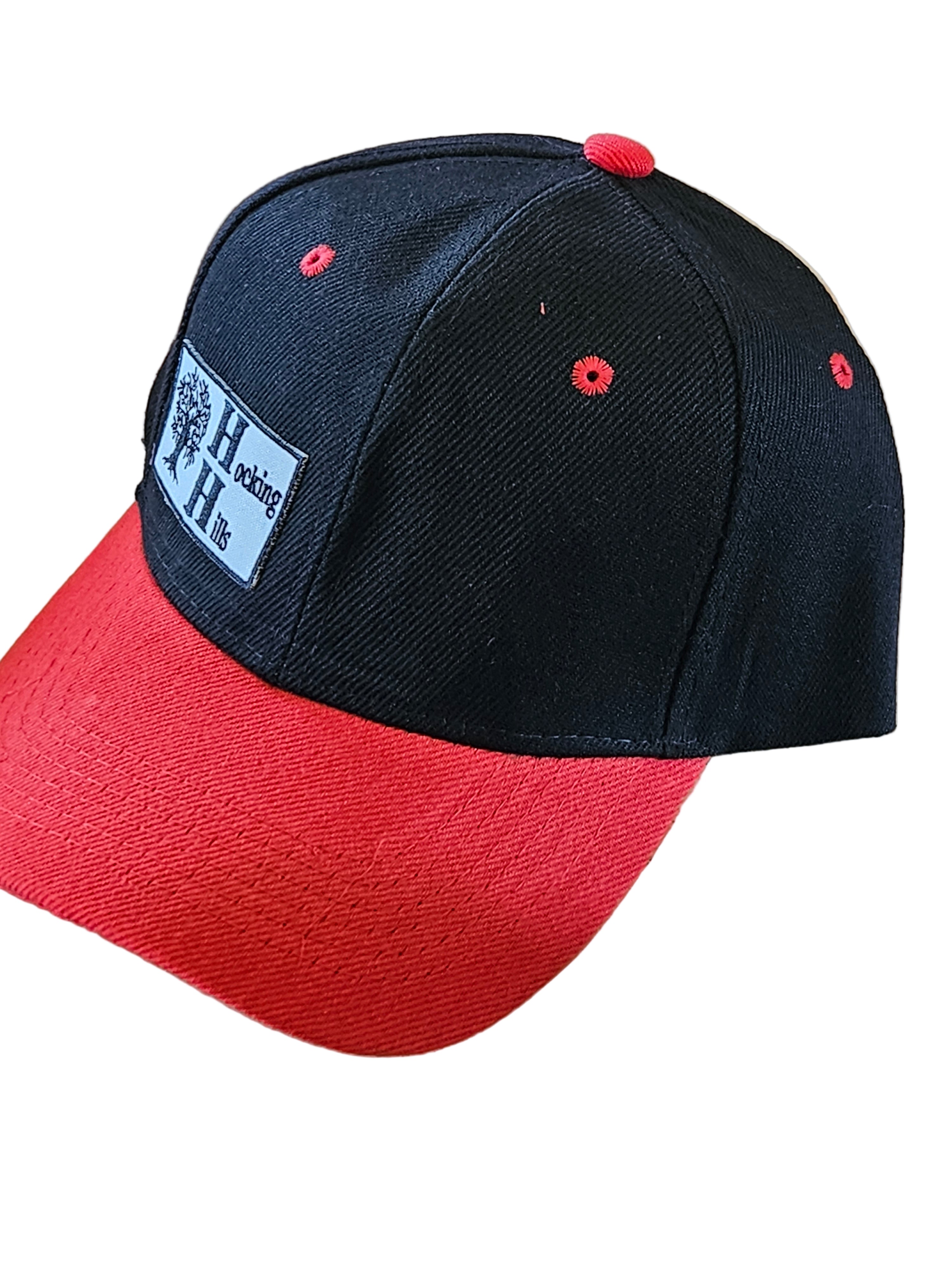 Red and black cap with a visible brand logo on a white surface