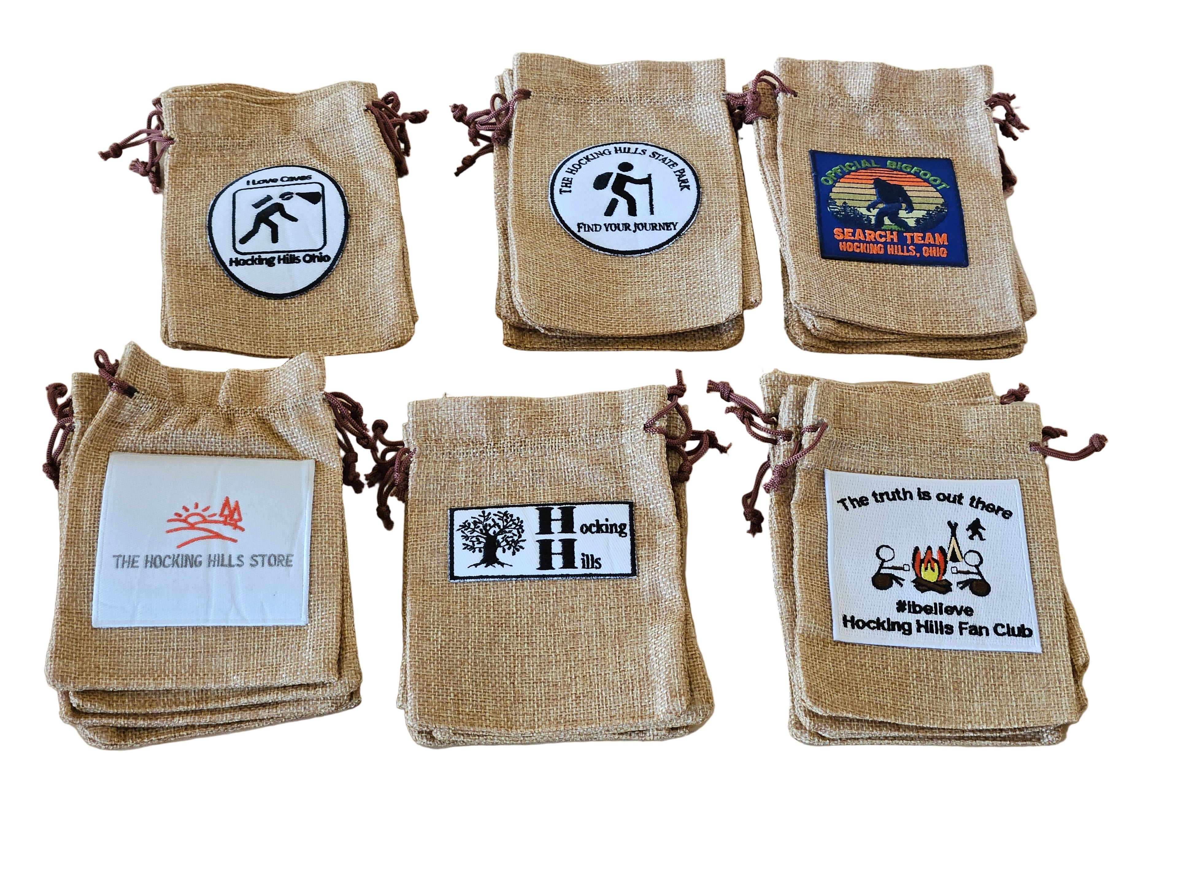 Set of burlap bags with various logos on a white surface