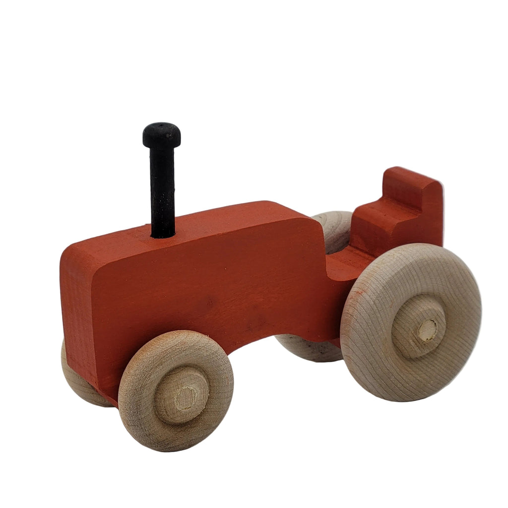 Wooden toy car with red body, beige wheels, and black axle on a white background