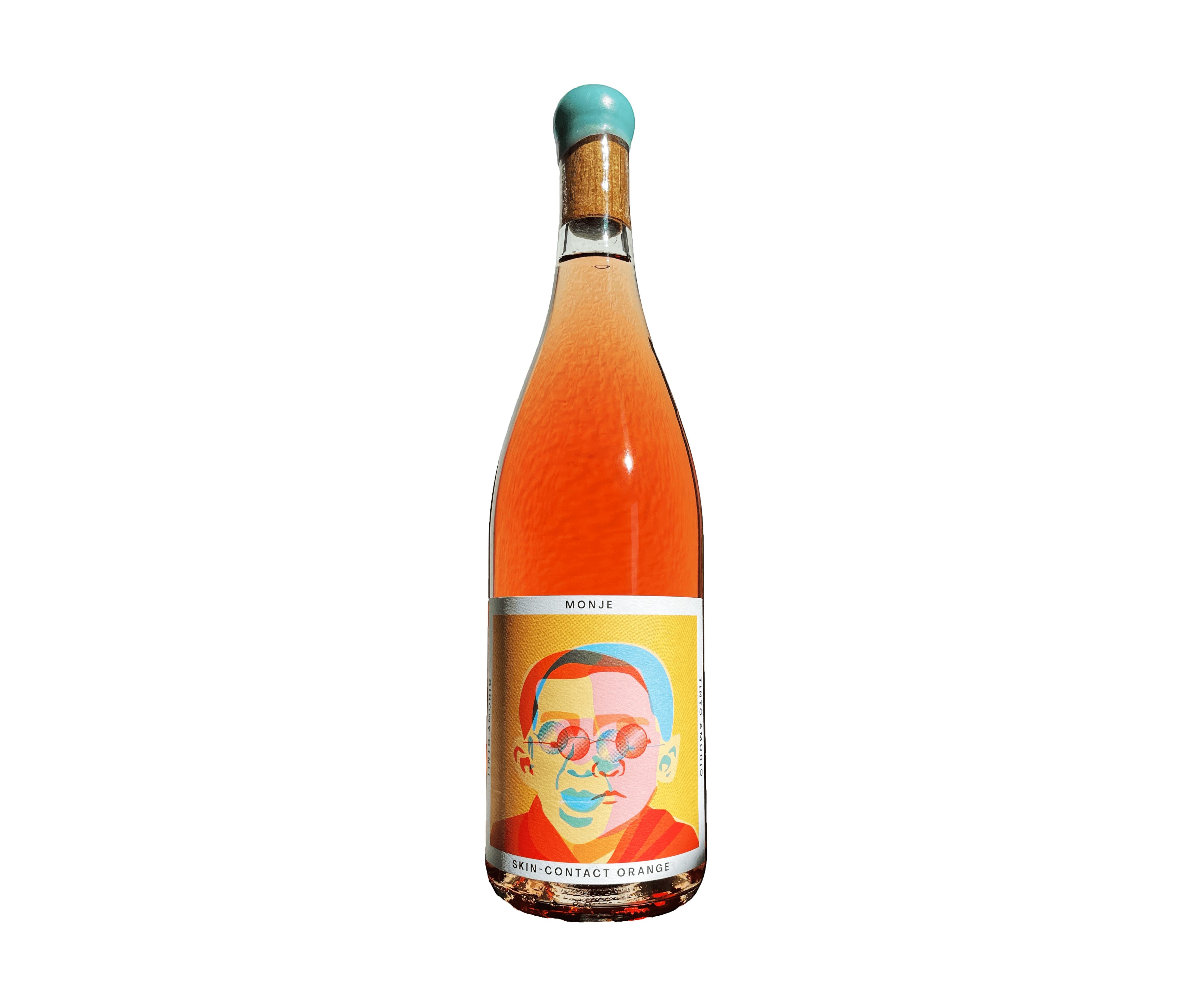 The Hocking Hills Store Monje 7-day skin-contact orange wine in a clear bottle with a colorful label featuring a portrait and a turquoise cap.