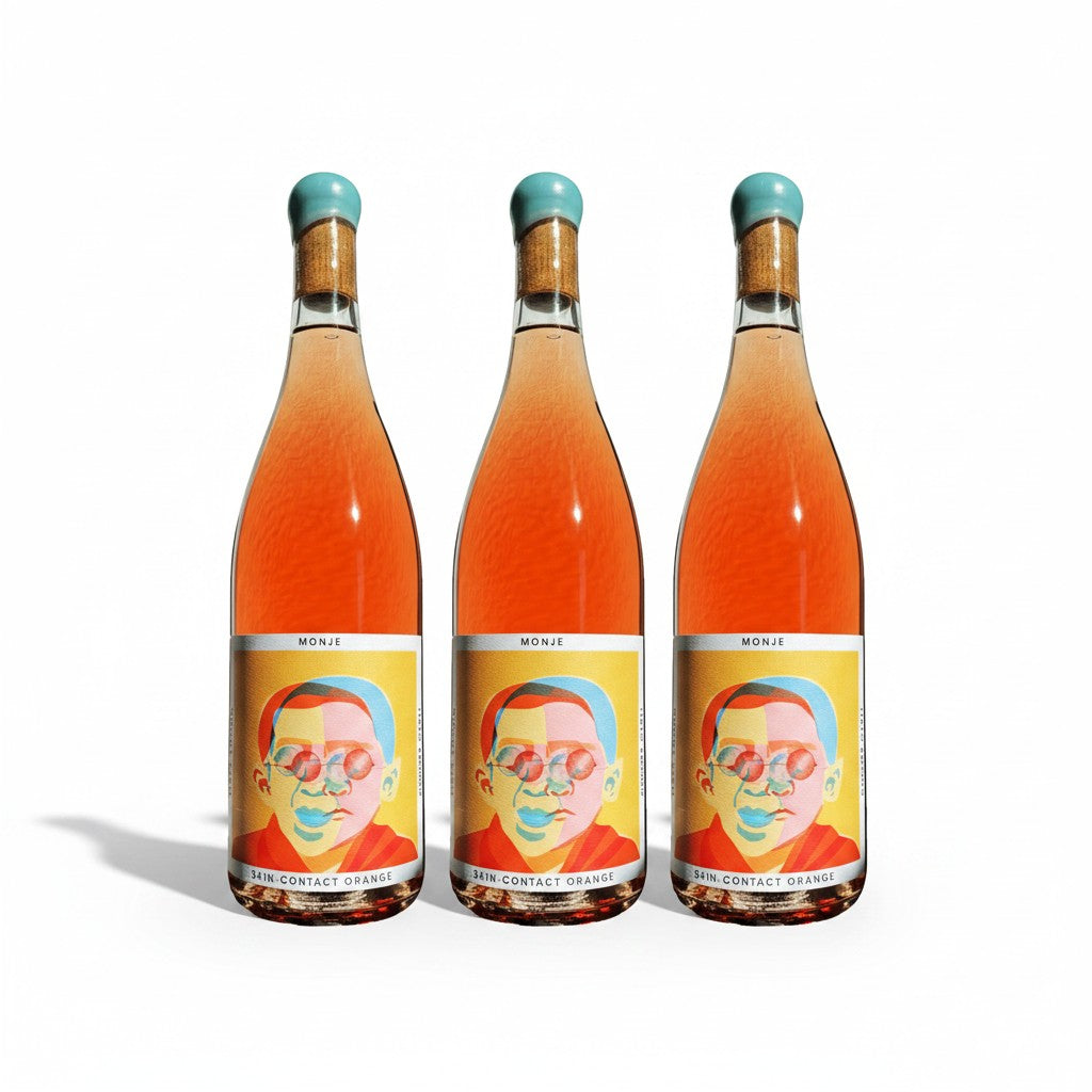 The Hocking Hills Store Monje 7-day skin-contact orange wine bottle with a colourful abstract portrait label.