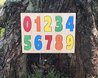 The Hocking Hills Store handmade wooden number puzzle with colorful numbers 0-9. Natural wood educational toy for toddlers.