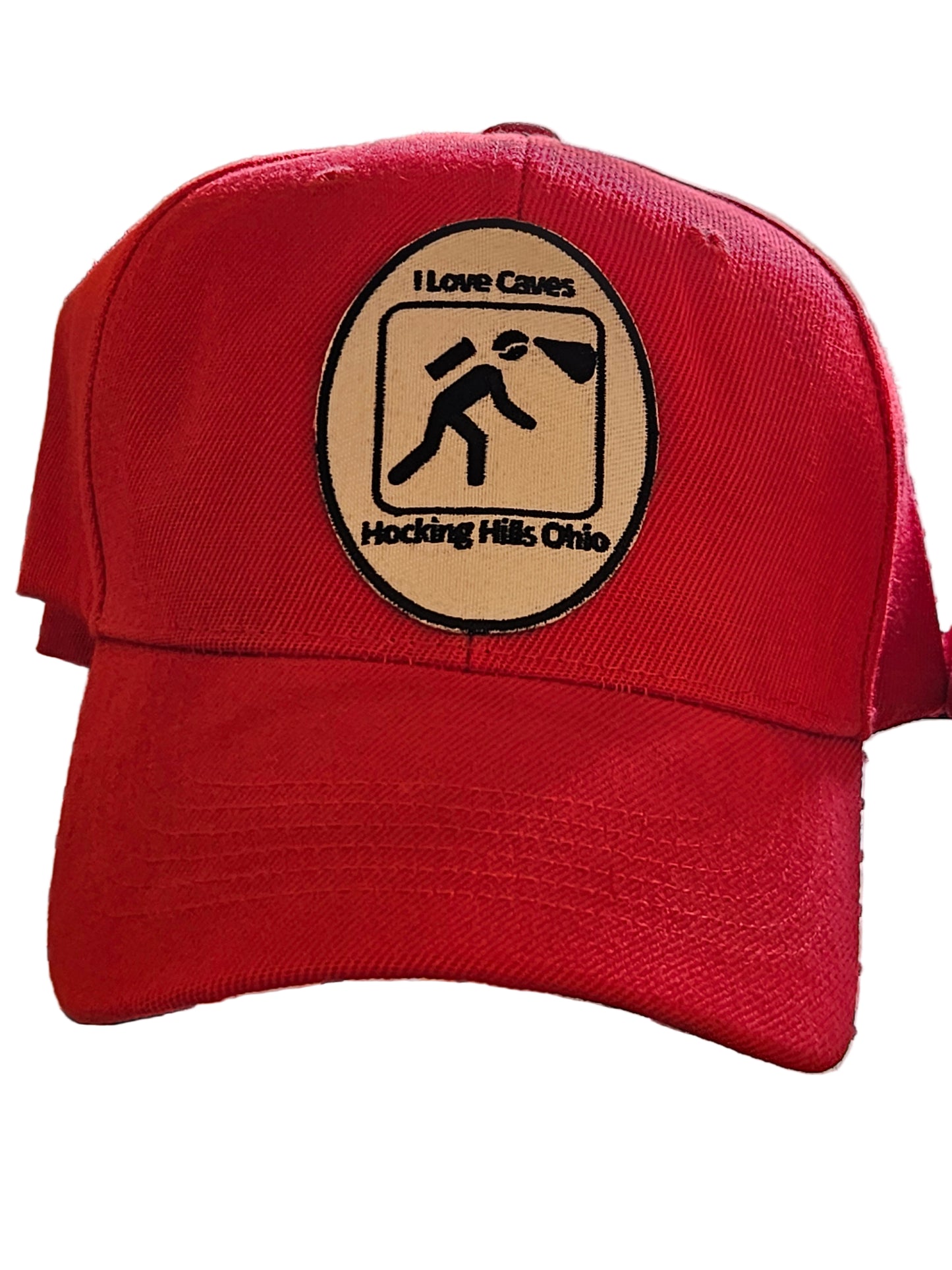 Red headgear with a logo on a black metal surface