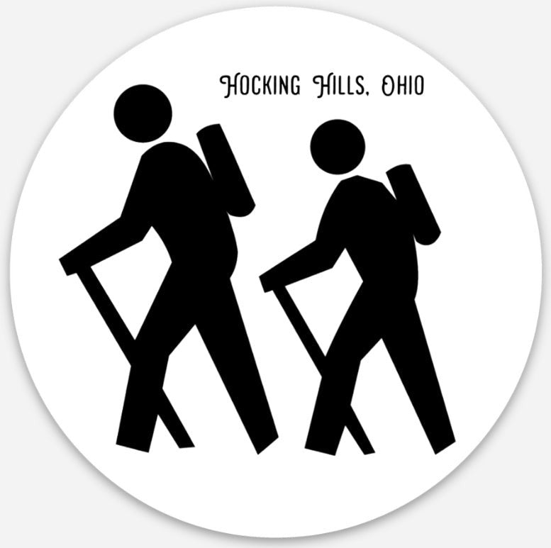The Hocking Hills Store oval sticker featuring two black hikers with backpacks and trekking poles, text reads Hocking Hills, Ohio.