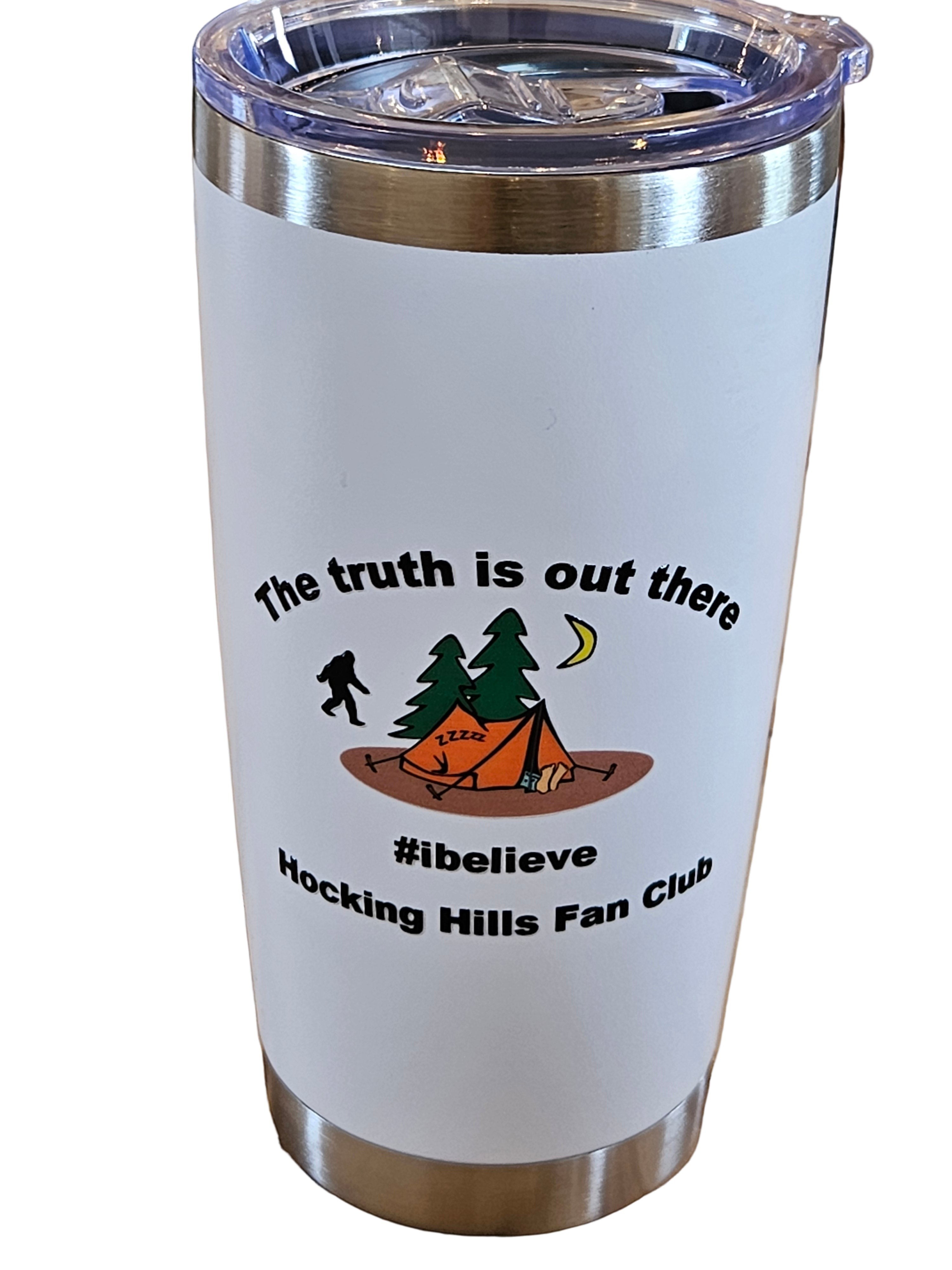 The Hocking Hills Store 20 oz white tumbler with Bigfoot, tent, and trees graphic. Features text "The truth is out there #ibelieve Hocking Hills Fan Club".