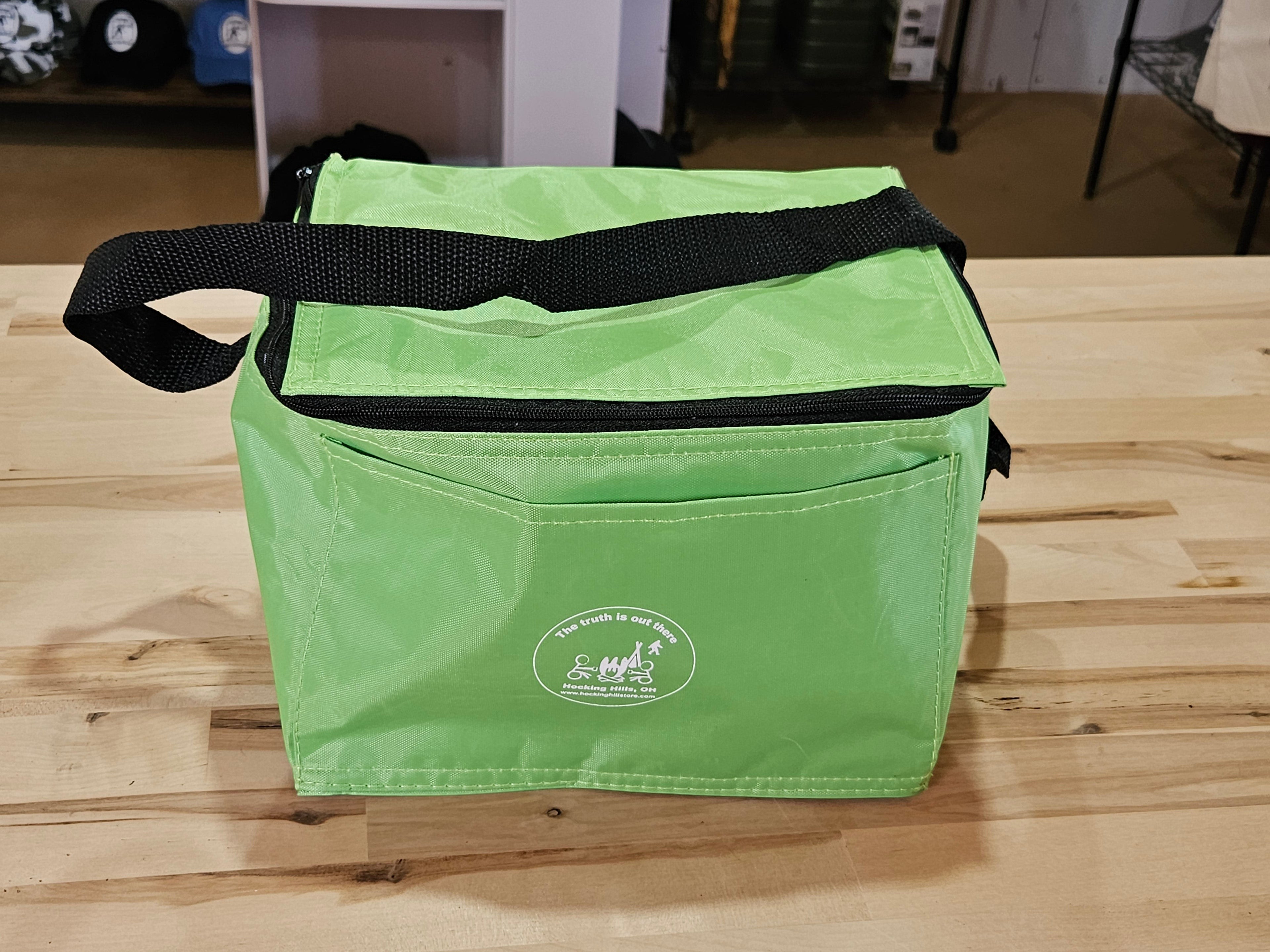 The Hocking Hills Store 6 Pack Soft Cooler in lime green with black trim and handle. Features a zippered top and front pocket.