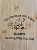 The Hocking Hills Store bamboo cutting board with Bigfoot, tent, trees, moon, and text "The truth is out there #ibelieve Hocking Hills Fan Club".