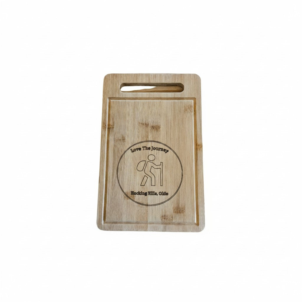 The Hocking Hills Store rectangle bamboo cutting board with engraved hiker graphic and