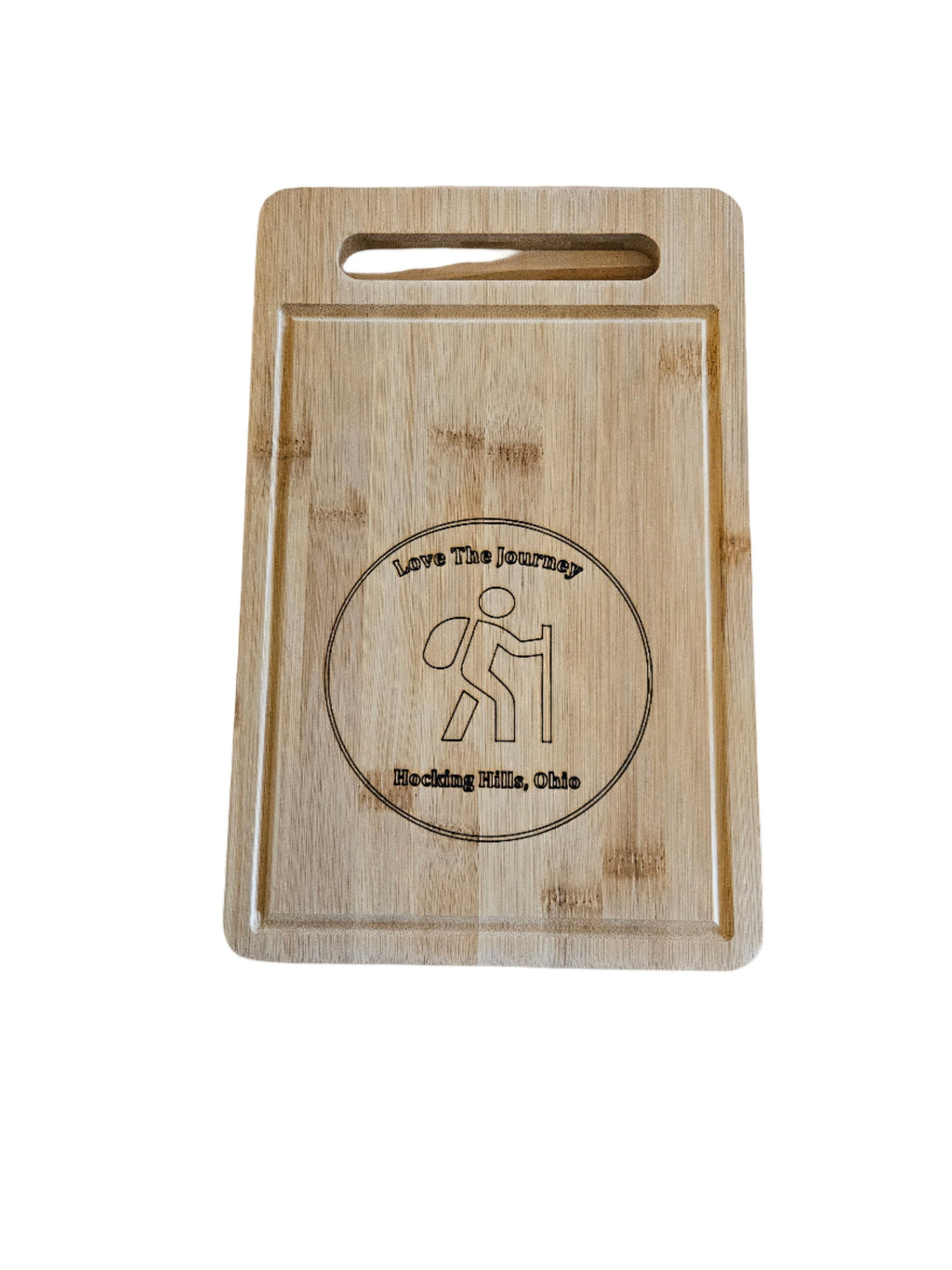 The Hocking Hills Store rectangle bamboo cutting board with engraved hiker graphic and