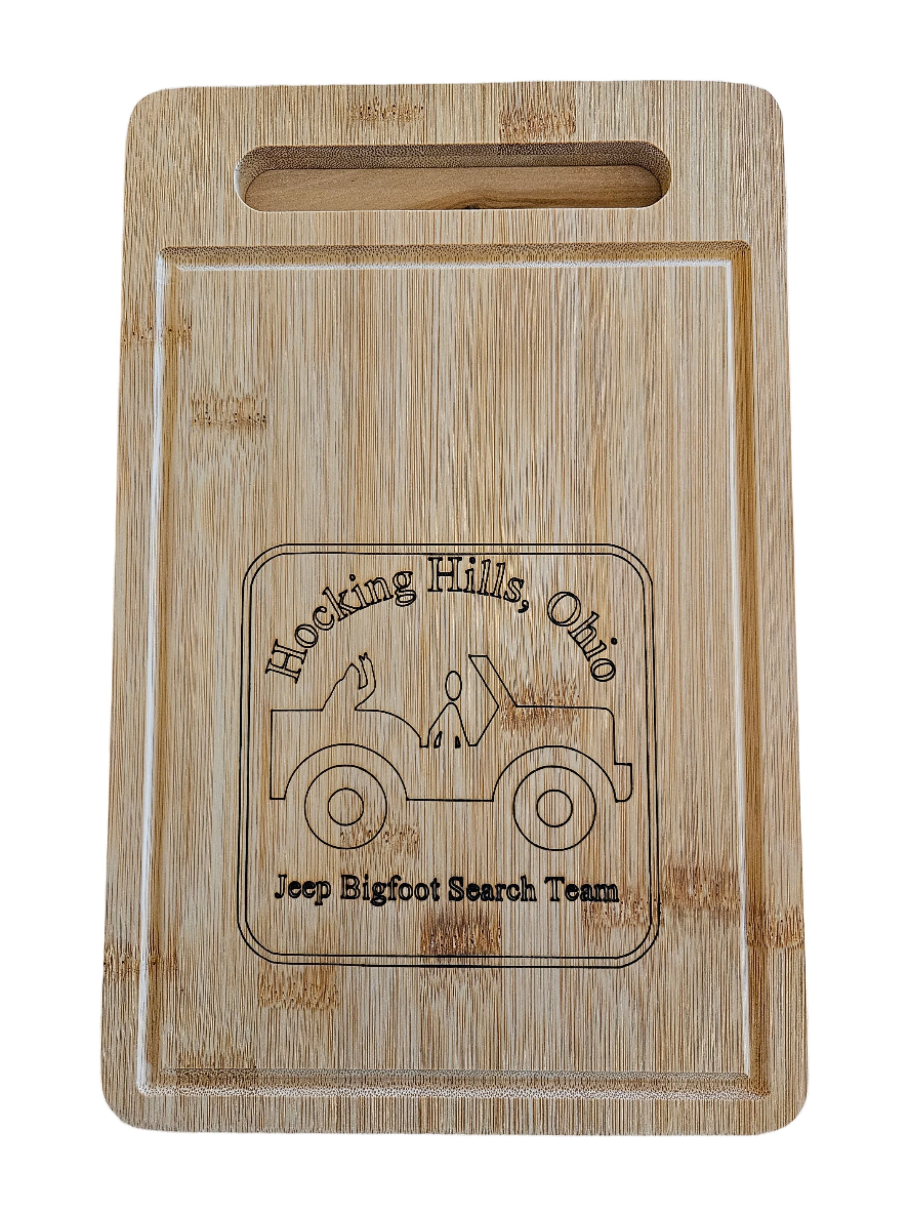 The Hocking Hills Store rectangle bamboo cutting board with a carved graphic of a jeep and the text "Hocking Hills, Ohio Jeep Bigfoot Search Team".