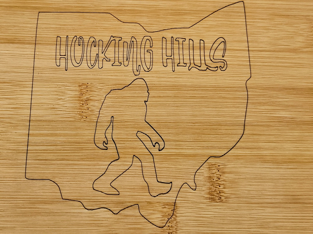 The Hocking Hills Store bamboo cutting board with laser engraved Ohio outline and Bigfoot graphic.
