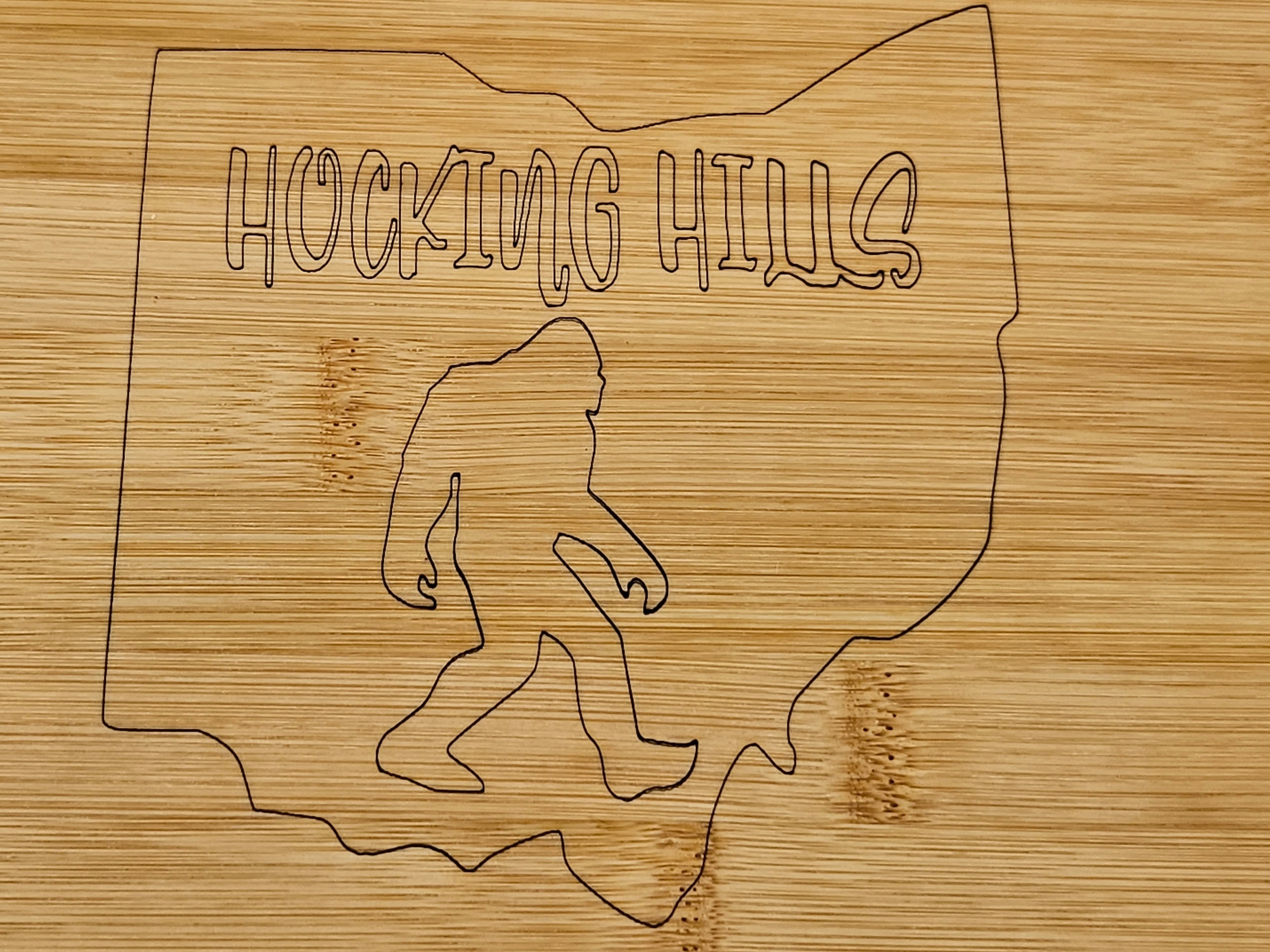 The Hocking Hills Store bamboo cutting board with laser engraved Ohio outline and Bigfoot graphic.