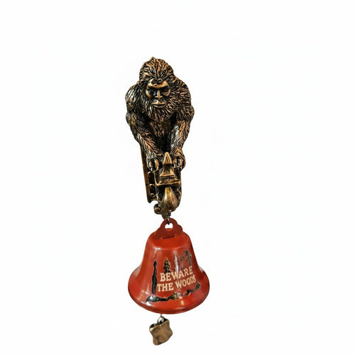 The Hocking Hills Store Bigfoot Wall Art and Bell features a metal Bigfoot figure above a red bell with "BEWARE THE WOODS" text and forest graphics.