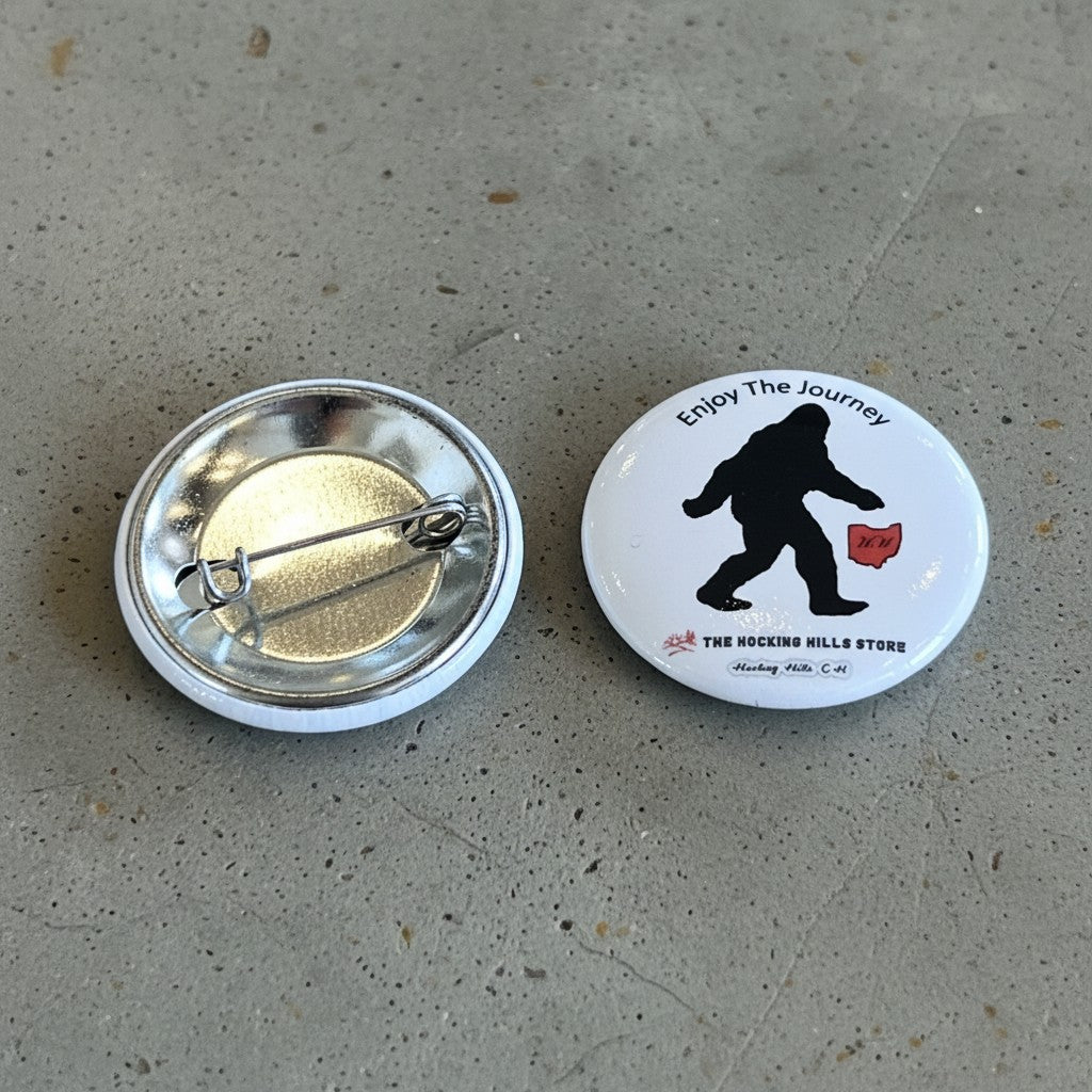 The Hocking Hills Store Bigfoot Enjoy the Journey button with silhouette of Bigfoot and Ohio map.