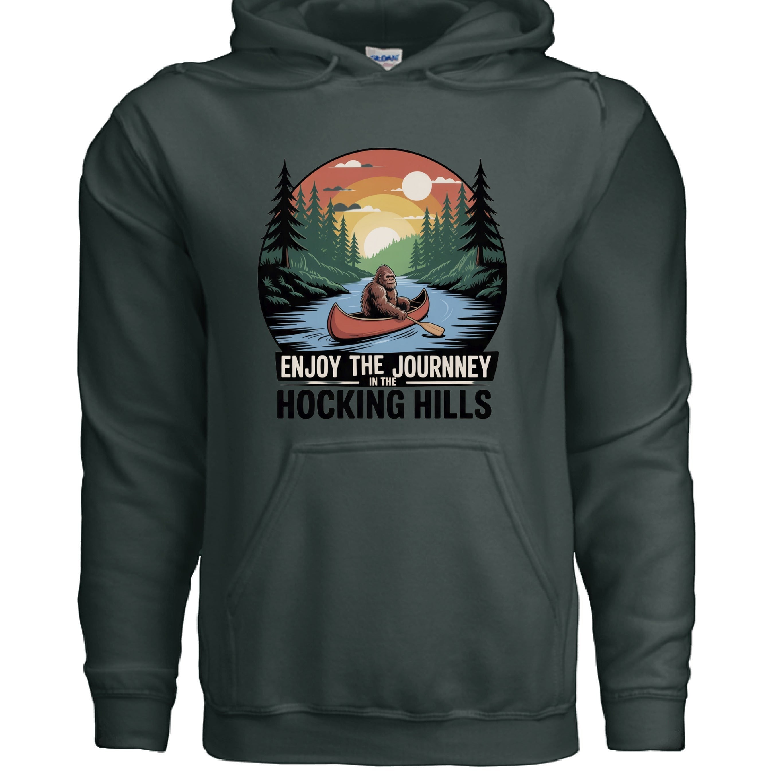 The Hocking Hills Store dark grey cotton blend hoodie featuring a graphic of Bigfoot canoeing at sunset with text "Enjoy The Journey In The Hocking Hills."
