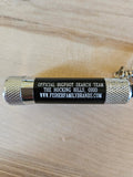 The Hocking Hills Store Bigfoot Search Team mini flashlight keychain with silver textured ends and black body.