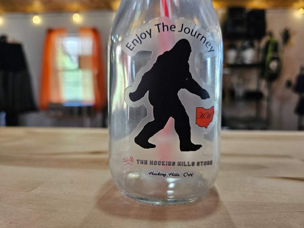 The Hocking Hills Store Bigfoot Glass Sipper with integrated straw and "Enjoy The Journey" text.