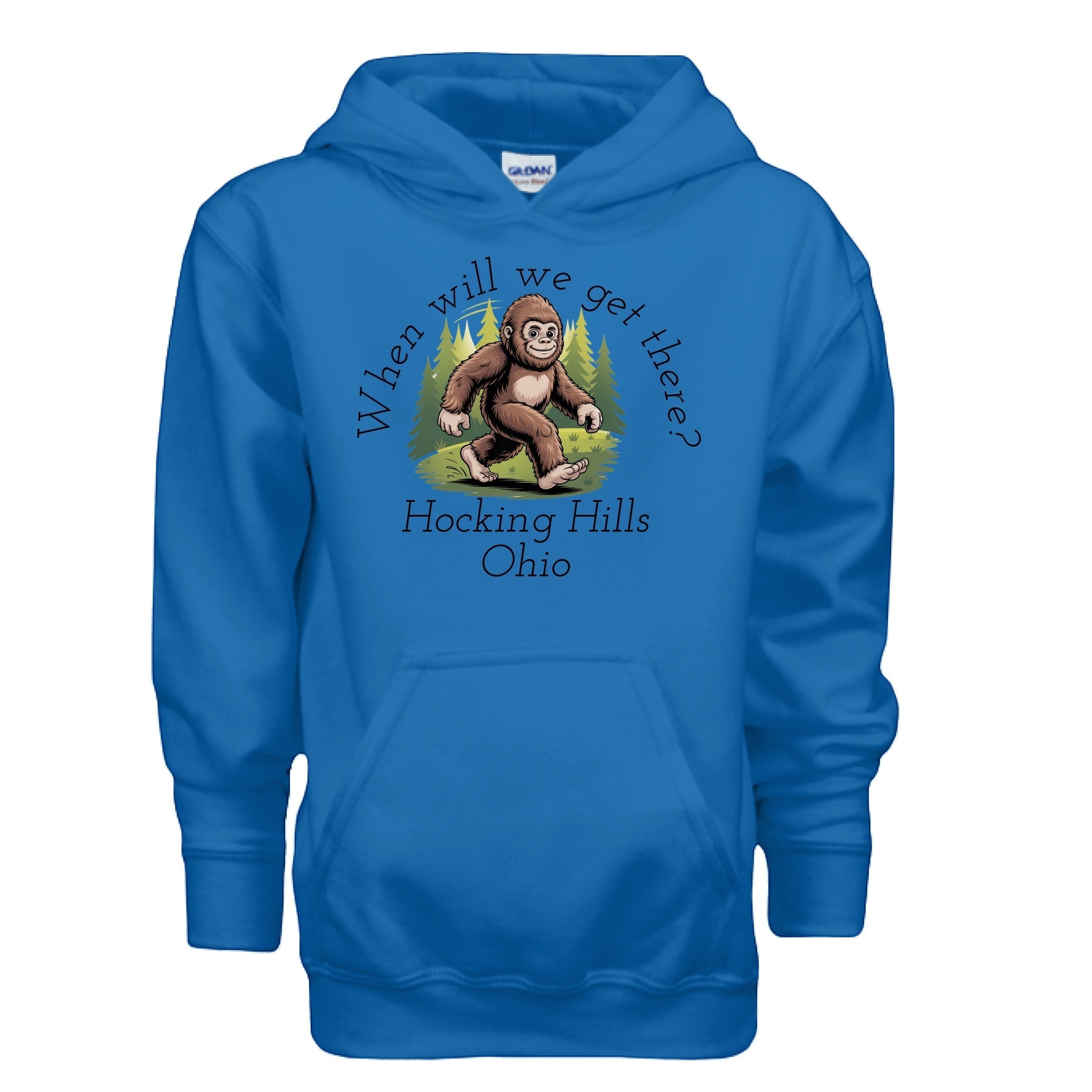 The Hocking Hills Store blue youth Bigfoot hoodie with a graphic of Bigfoot walking in a forest with the text "When Will We Get There?" and "Hocking Hills Ohio".