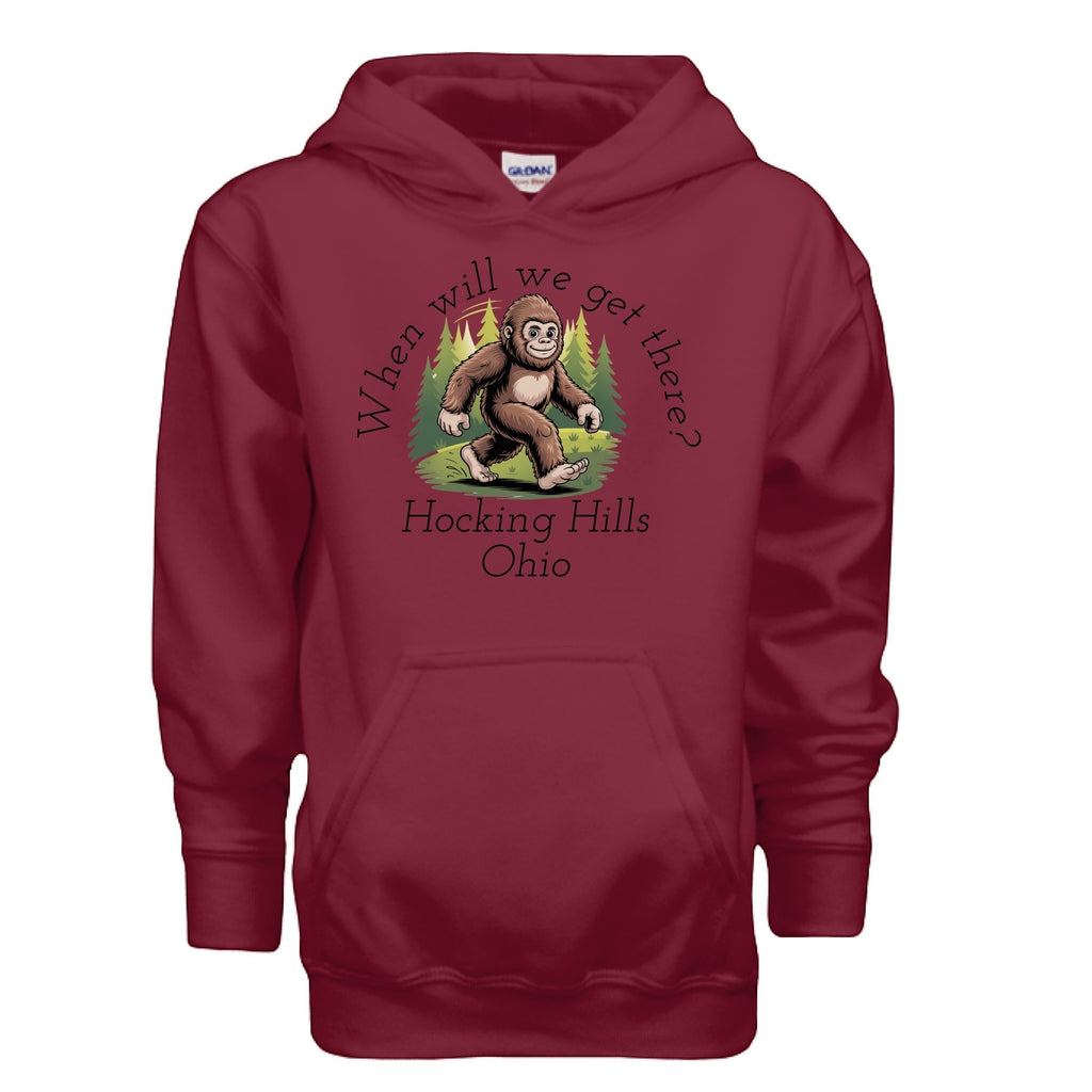 The Hocking Hills Store maroon youth hoodie with a Bigfoot graphic and "When Will We Get There?" text.