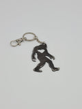 The Hocking Hills Store Bigfoot metal keychain with a heart cutout, attached to a silver keyring and clasp.