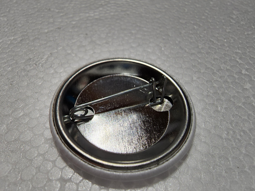 The Hocking Hills Store Big Foot Milk Carton Button with metal pin backing.