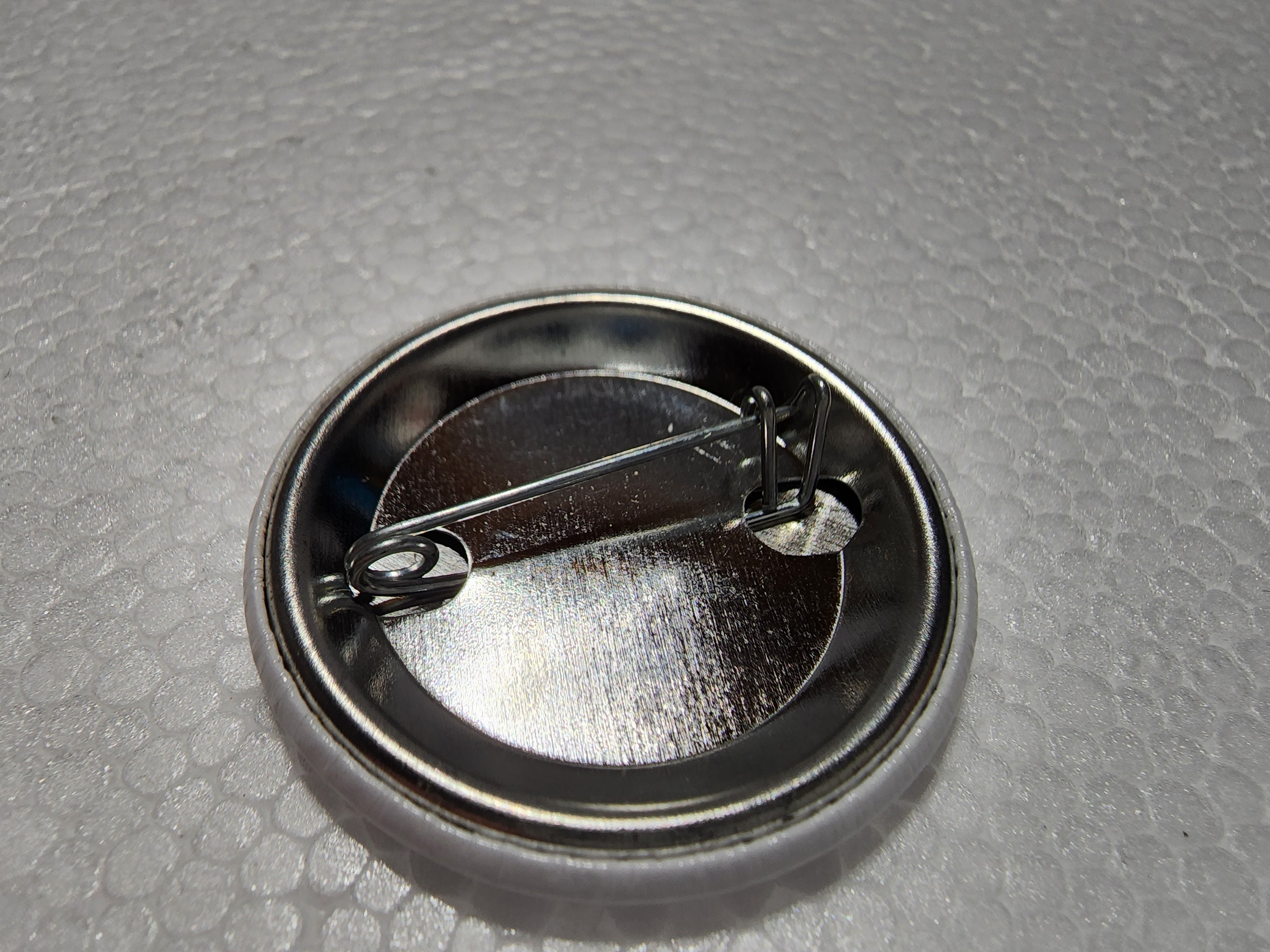 The Hocking Hills Store Big Foot Milk Carton Button with metal pin backing.