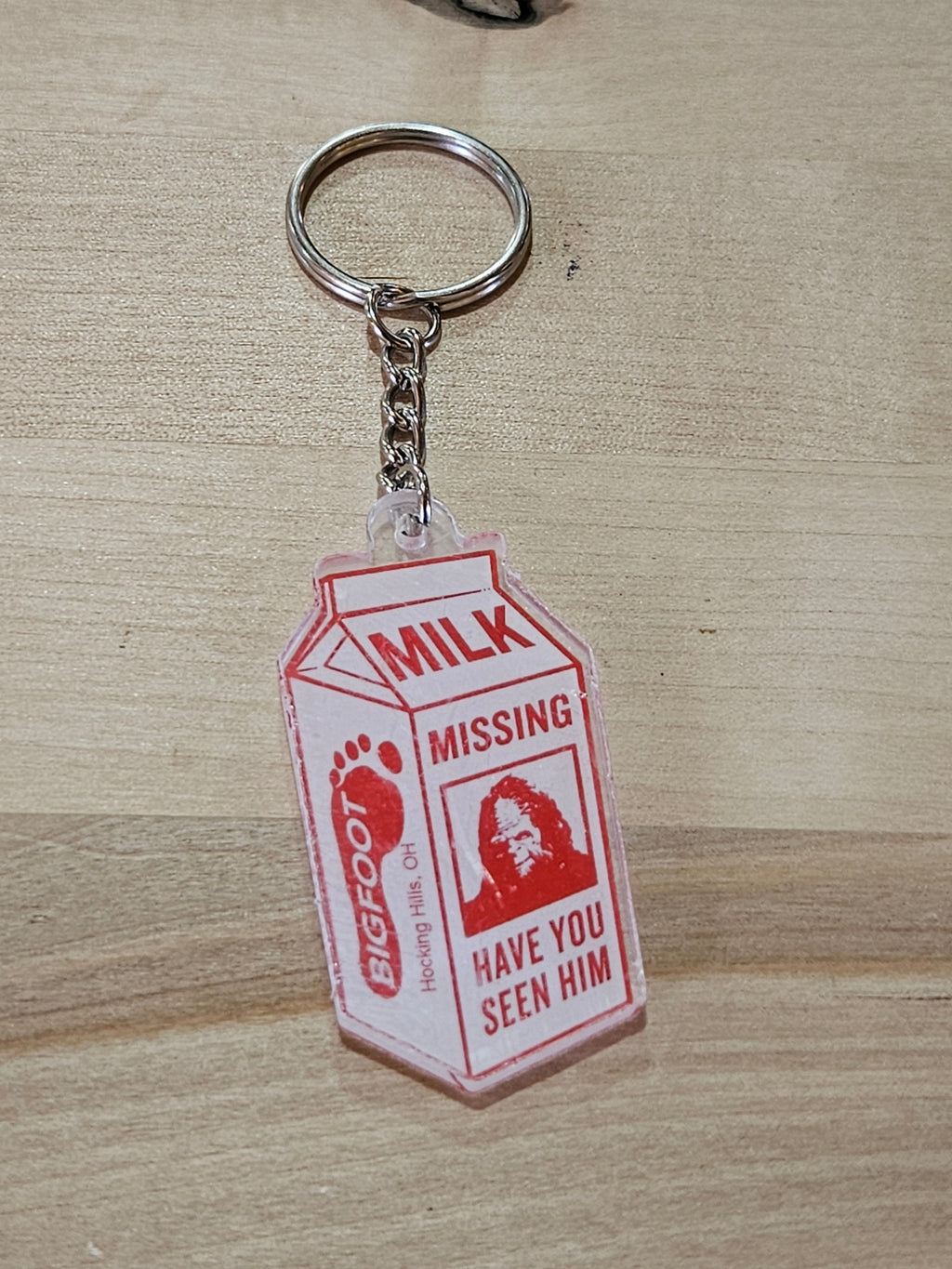The Hocking Hills Store Bigfoot milk carton keychain with red text and Bigfoot image.