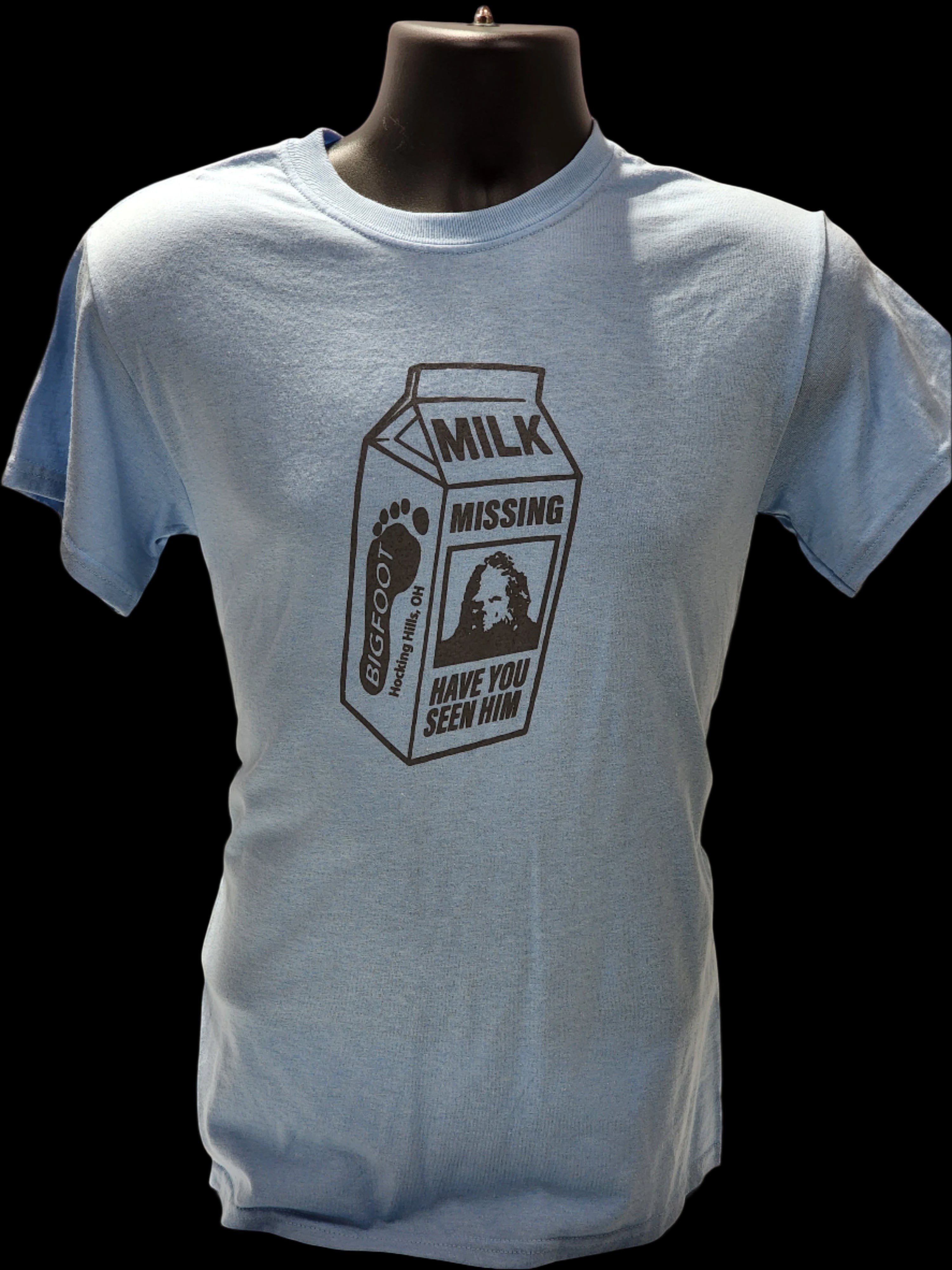 The Hocking Hills Store light blue cotton t-shirt with a black Bigfoot milk carton missing design.