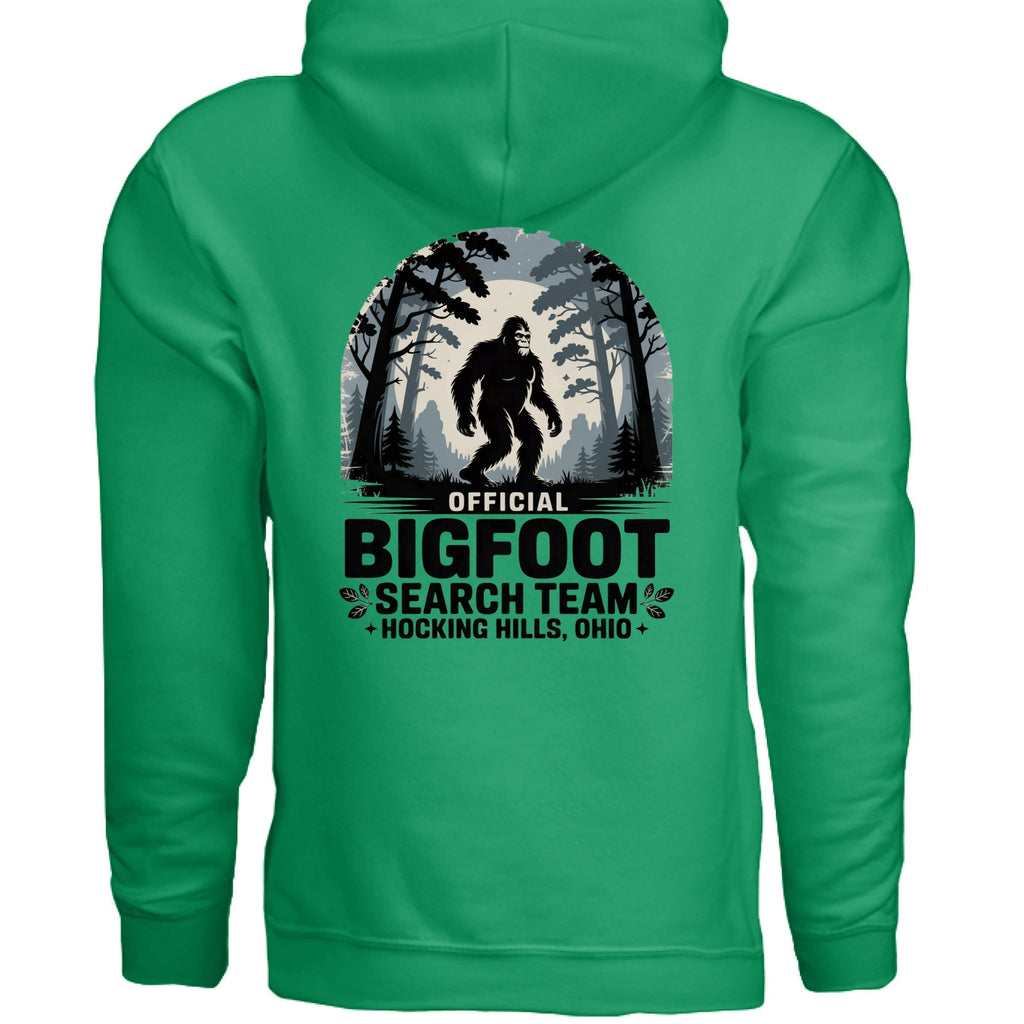 The Hocking Hills Store Official Bigfoot Search Team hoodie in green, featuring a Bigfoot graphic and forest scene.
